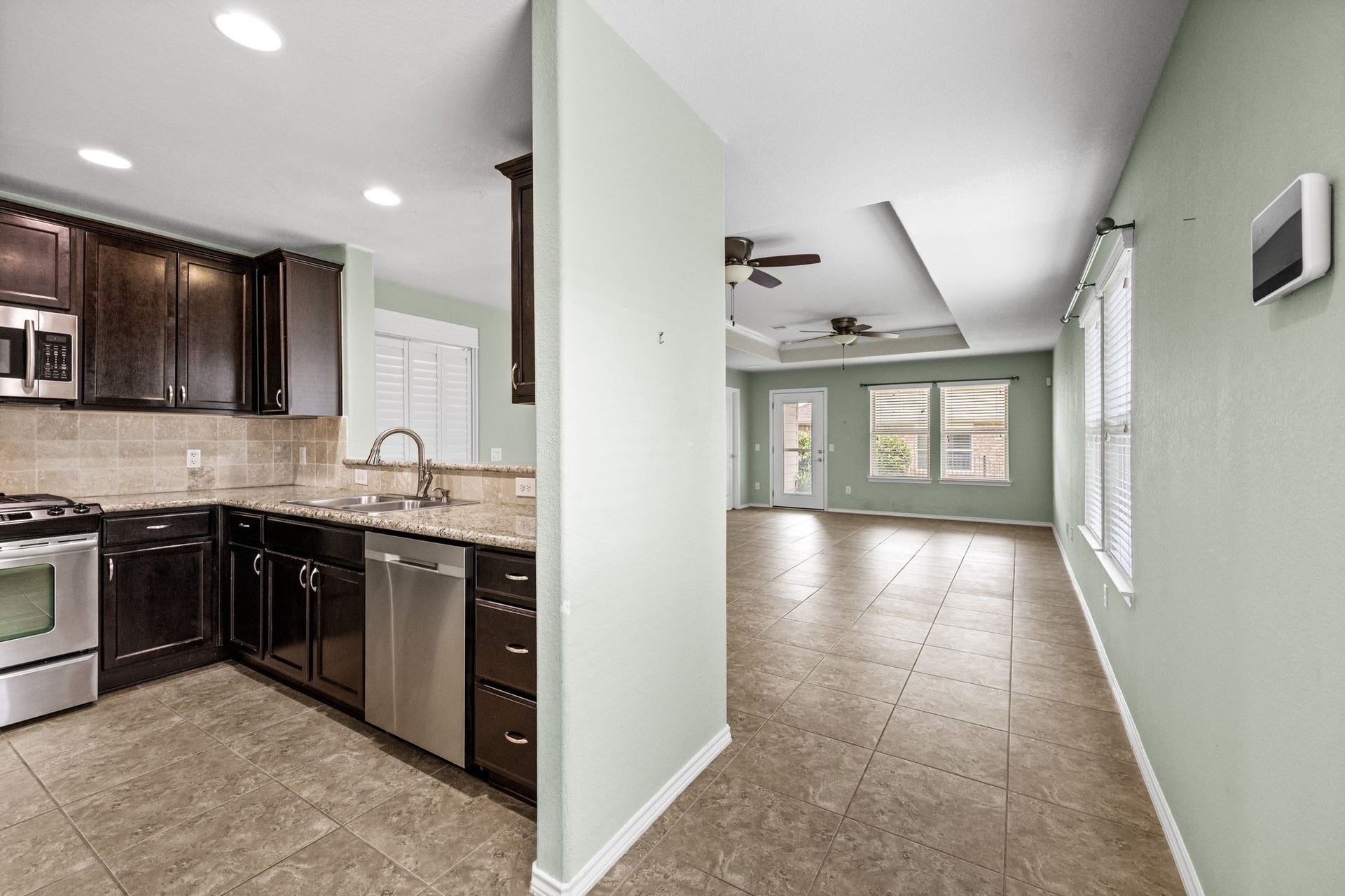 View from entry, kitchen immediately left and living area directly ahead.