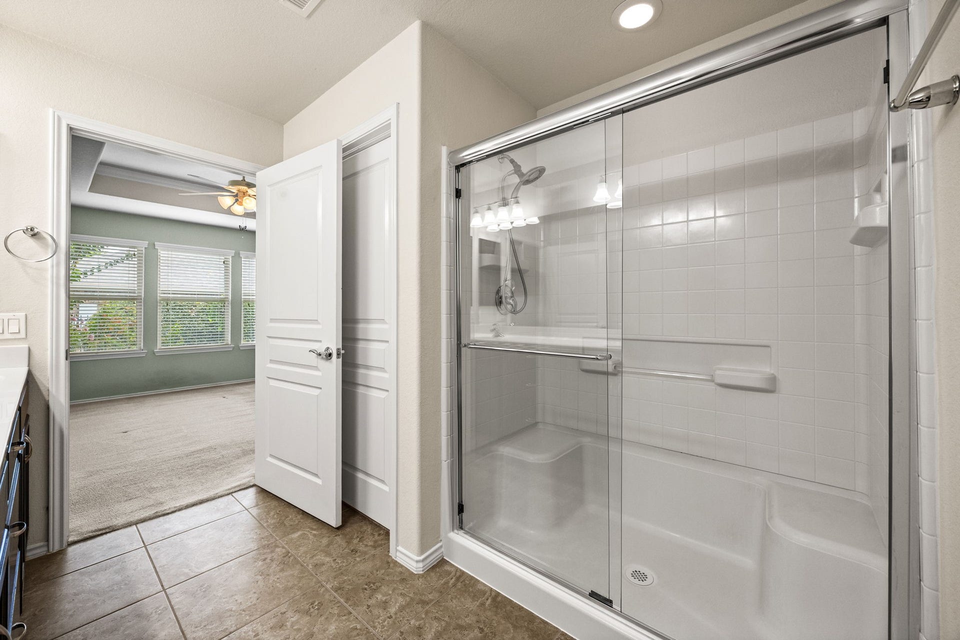 Primary Bath has HUGE walk-in shower with seating areas.