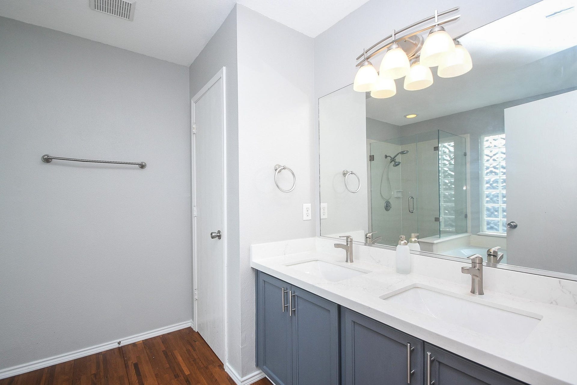 10222 Antelope Alley, Missouri City, TX 77459 Modern bathroom with a dual-sink vanity, sleek fixtures, and a spacious glass-enclosed shower.