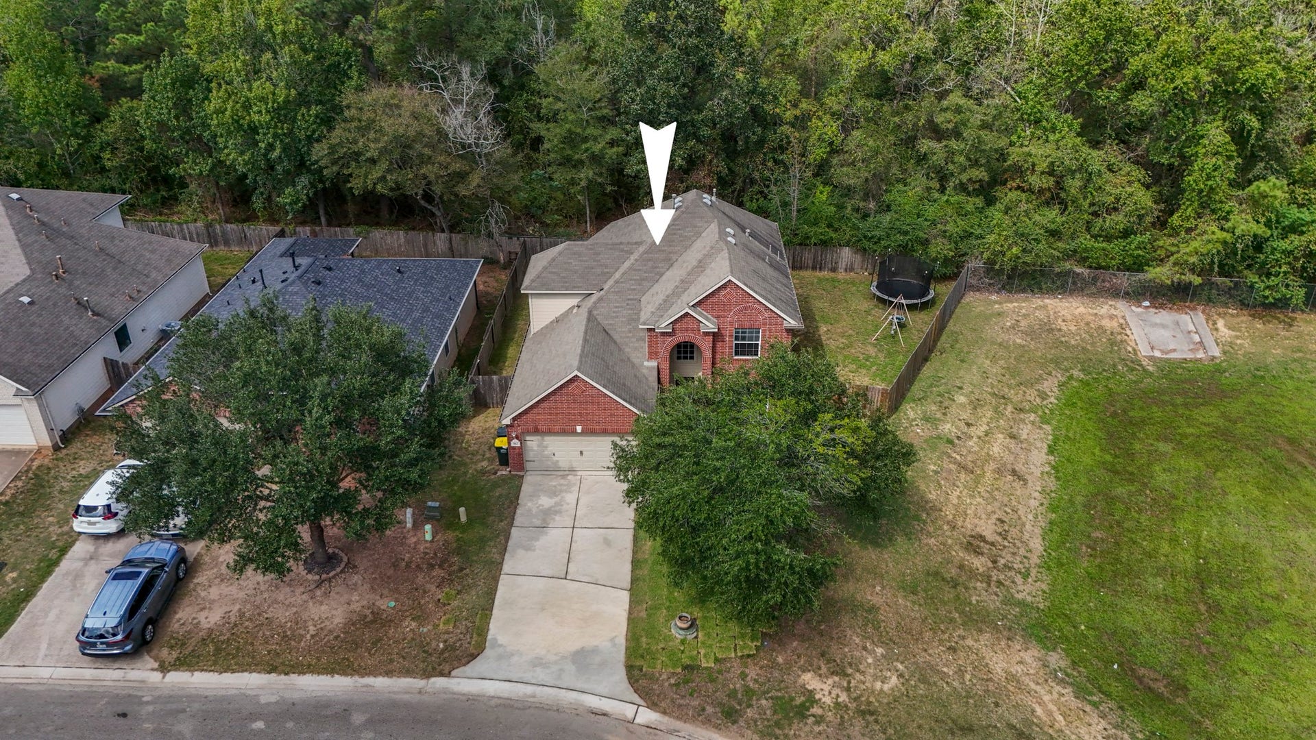 942 Oak Glen Drive, Conroe, TX 77378 This aerial view really shows off the settingno back neighbors and no neighbor along the right side of the home, giving the backyard and side yard a more open, private feel. Its the kind of setup that gives you more room to enjoy the outdoors without feeling boxed in.