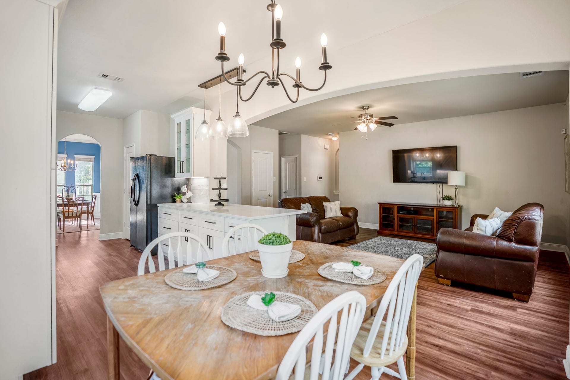 942 Oak Glen Drive, Conroe, TX 77378 This view really shows how the breakfast area, kitchen, and living room work together. The breakfast bar keeps the kitchen open to the surrounding spaces, so whoevers cooking can still stay part of the conversation while the living room sits just beyond.