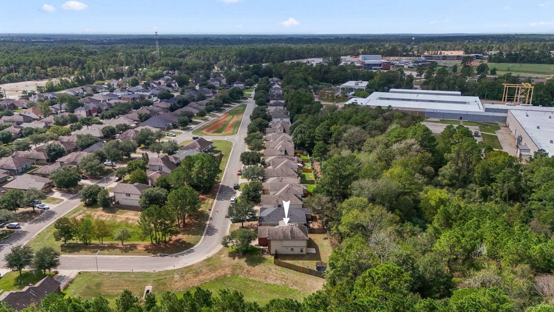 942 Oak Glen Drive, Conroe, TX 77378 This wider aerial pulls the setting together, showing Olde Oaks surrounded by mature trees with neighborhood streets opening out toward the surrounding Willis area. Its a nice reminder that home life here can feel a little more removed, while Lake Conroe, shopping, dining, and I-45 are still within easy reach.