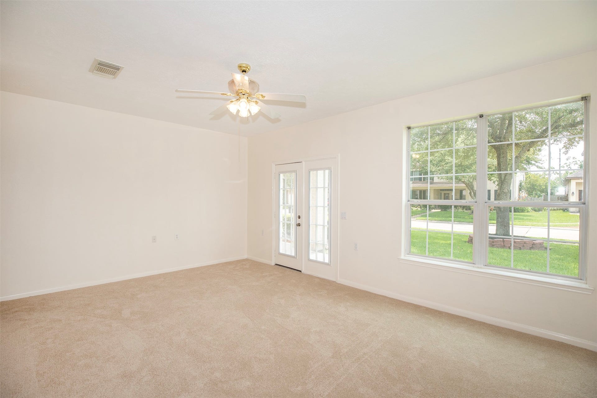 3612 Fir Hollow Way, Pearland, TX 77581 Rare first-floor secondary suite features accessible design elements, a spacious walk-in closet, and private exterior access through French doors, offering exceptional flexibility and privacy within the home.