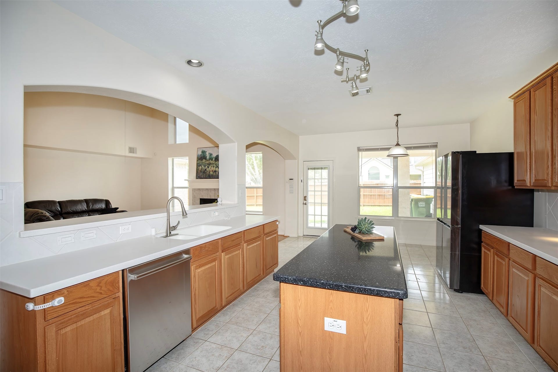 3612 Fir Hollow Way, Pearland, TX 77581 Designed to keep everyone connected, the kitchen overlooks the breakfast area and impressive two-story family room beyond.