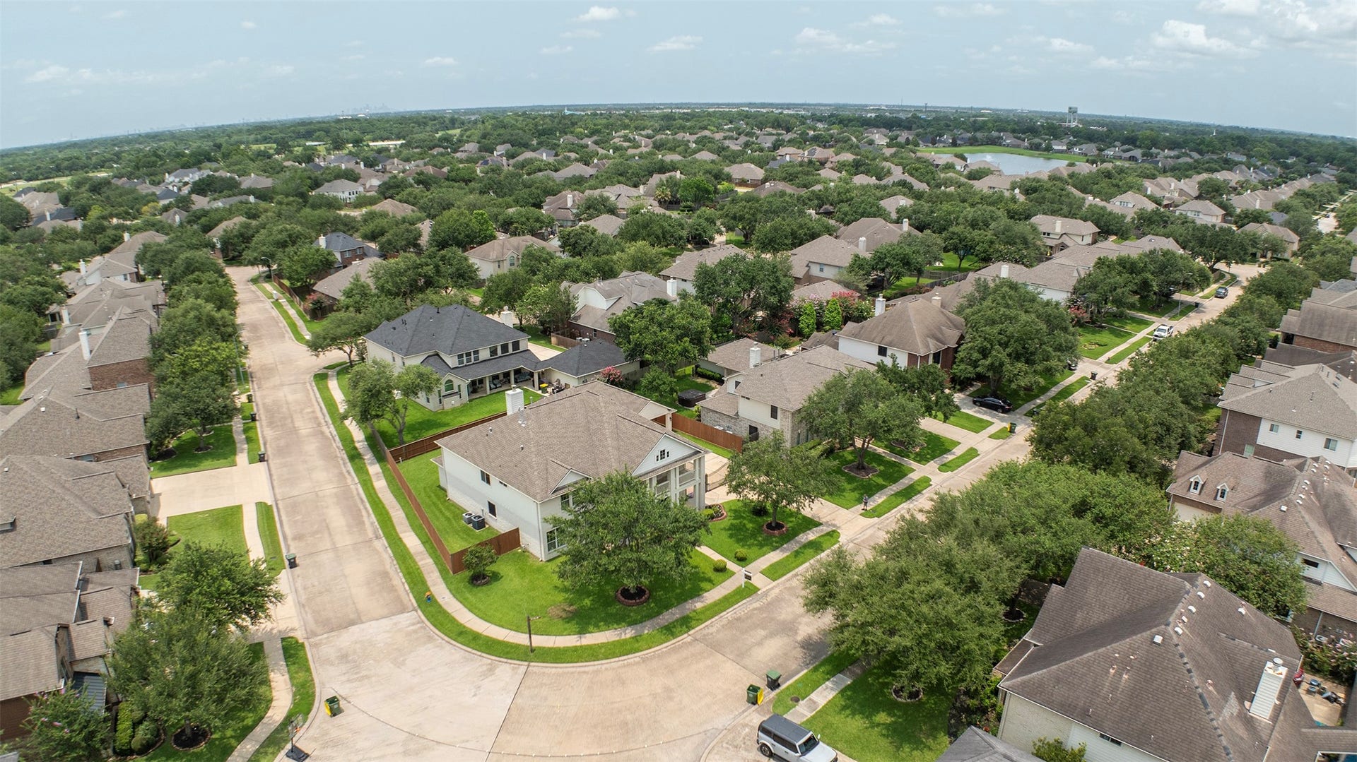 3612 Fir Hollow Way, Pearland, TX 77581 This aerial perspective highlights the home's desirable corner lot location, generous lot size, and prime position surrounded by well-maintained homes and tree-lined streets. Welcome Home!