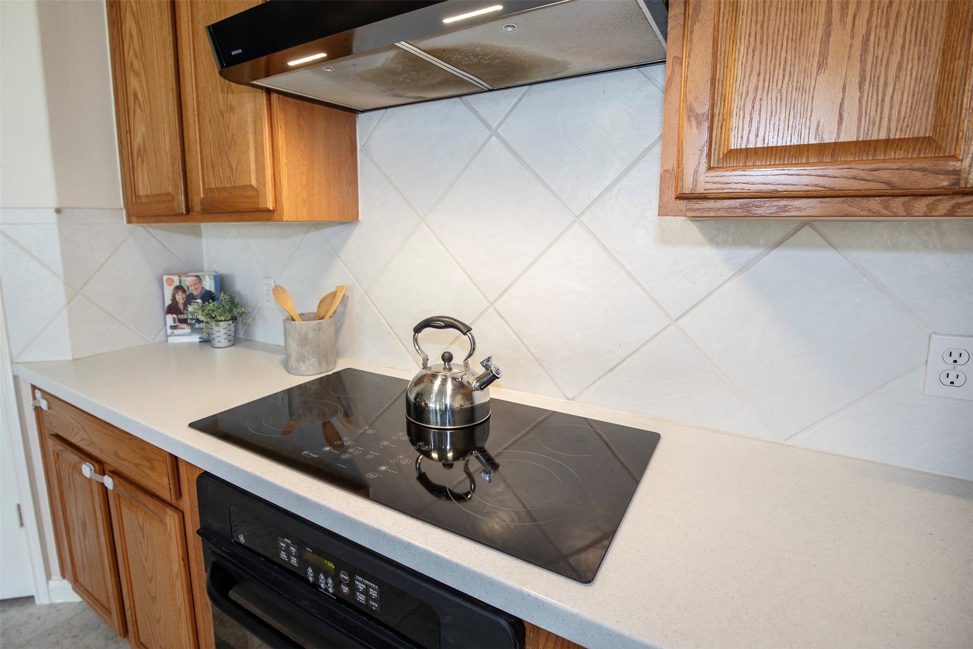 3612 Fir Hollow Way, Pearland, TX 77581 Thoughtfully designed cooking space with induction cooktop, extensive counters, and timeless finishes ready for your culinary creations.