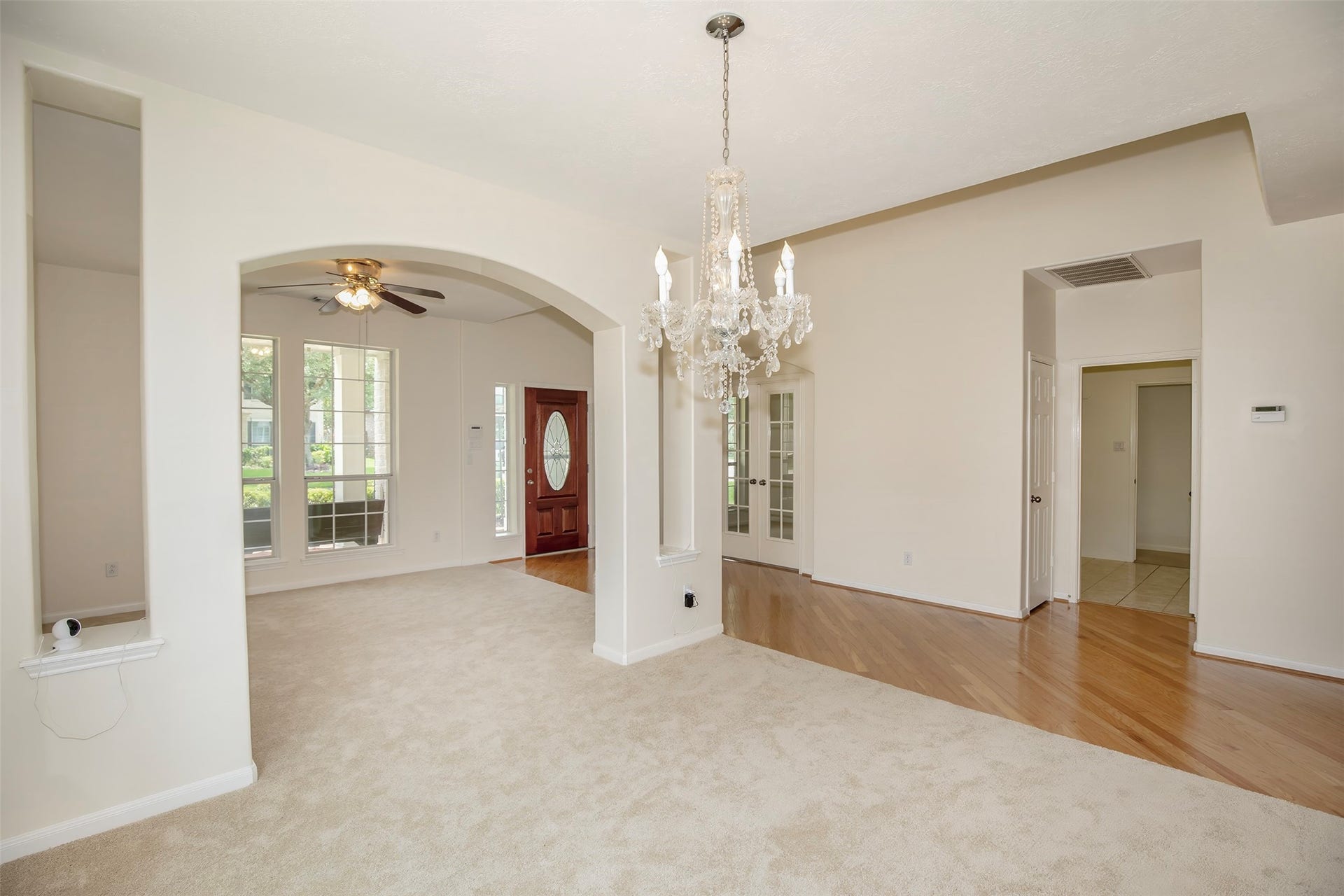 3612 Fir Hollow Way, Pearland, TX 77581 Beautiful archways, abundant natural light, and timeless finishes enhance the home's welcoming entry and gathering spaces.