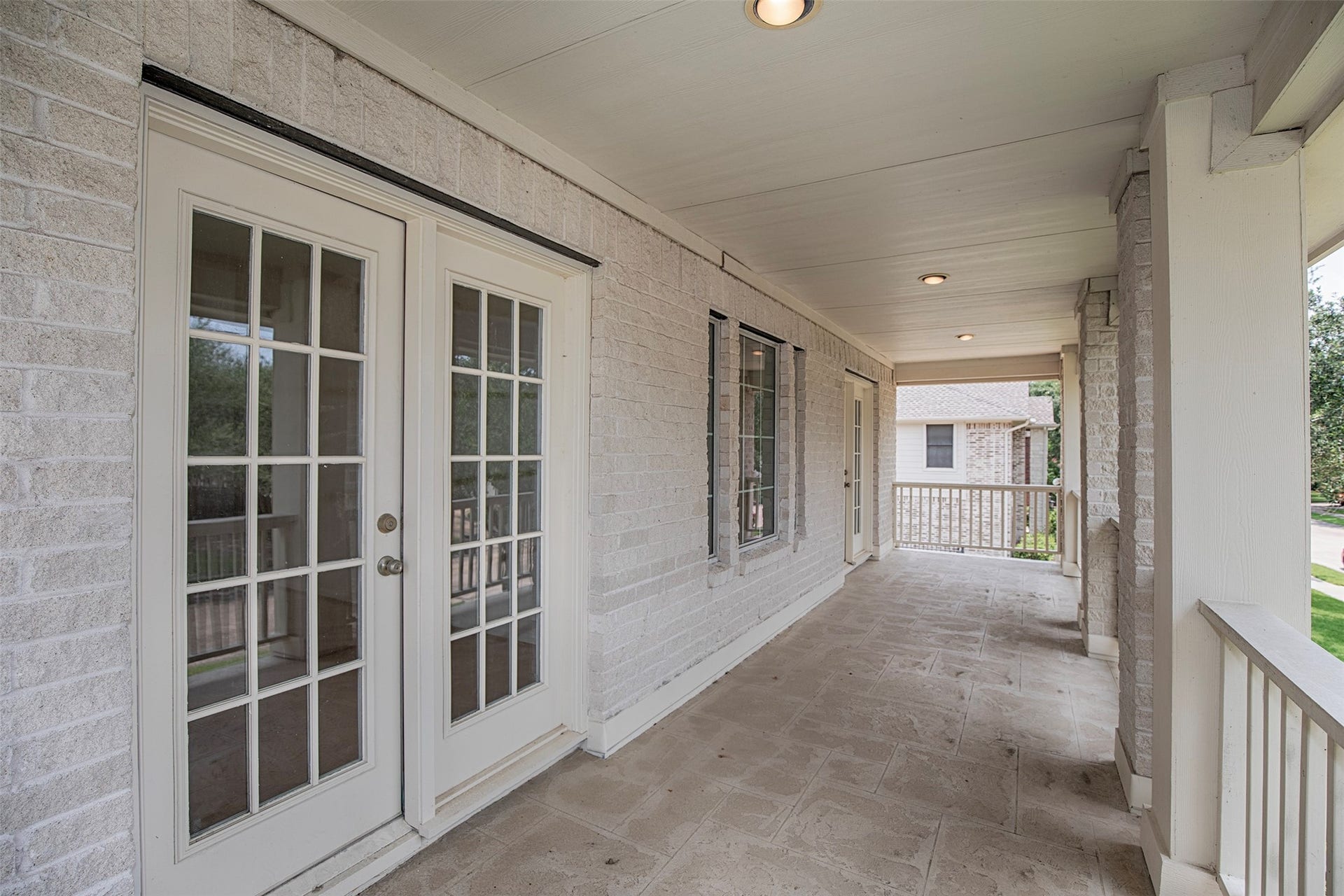 3612 Fir Hollow Way, Pearland, TX 77581 Enjoy morning coffee or unwind in the evening on this expansive second-story covered balcony, accessible from both an upstairs bedroom and home theater offering a peaceful place to relax and enjoy the neighborhood views.