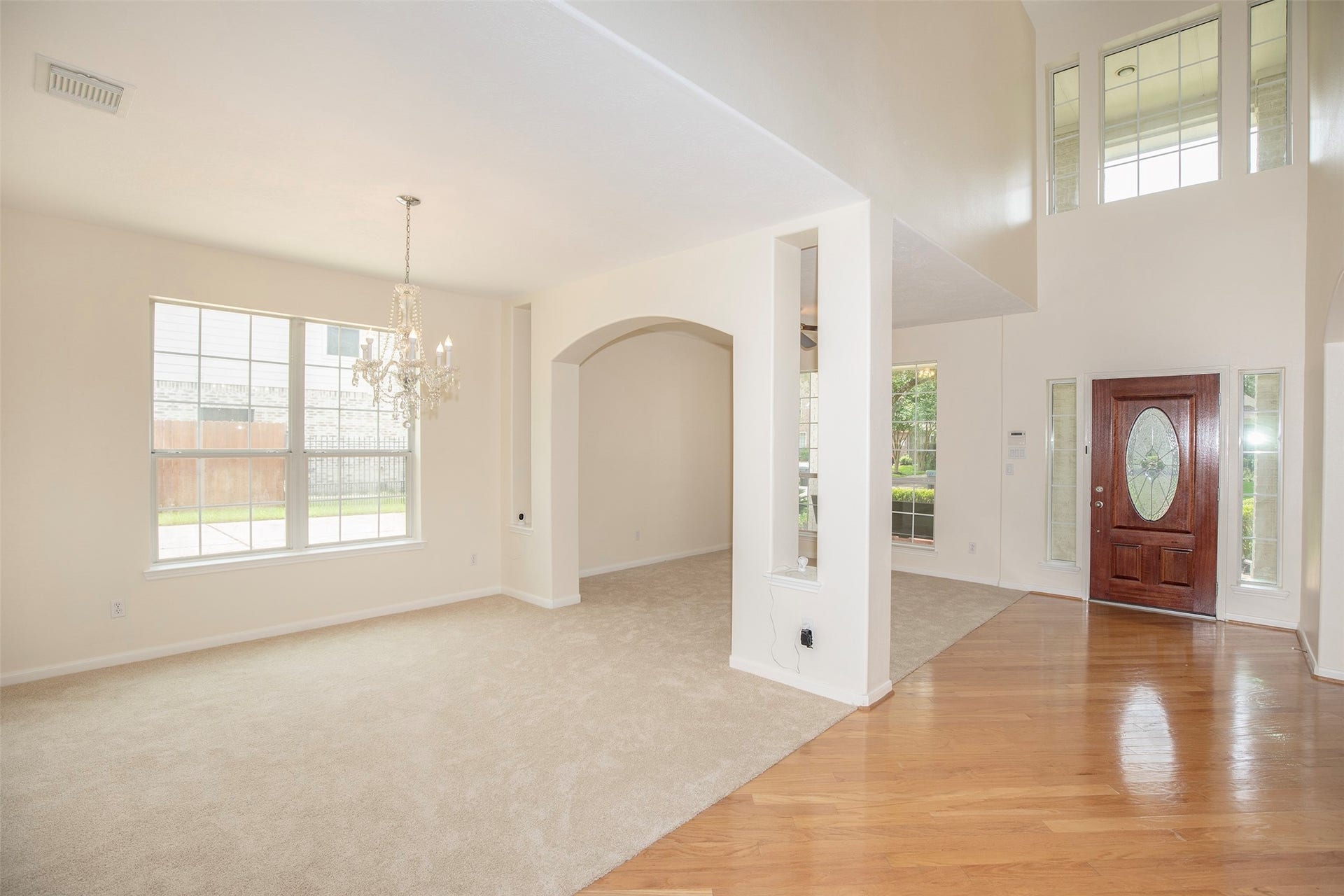 3612 Fir Hollow Way, Pearland, TX 77581 Step inside to soaring ceilings, rich wood flooring, and beautifully connected formal living and dining spaces designed for entertaining and everyday comfort.