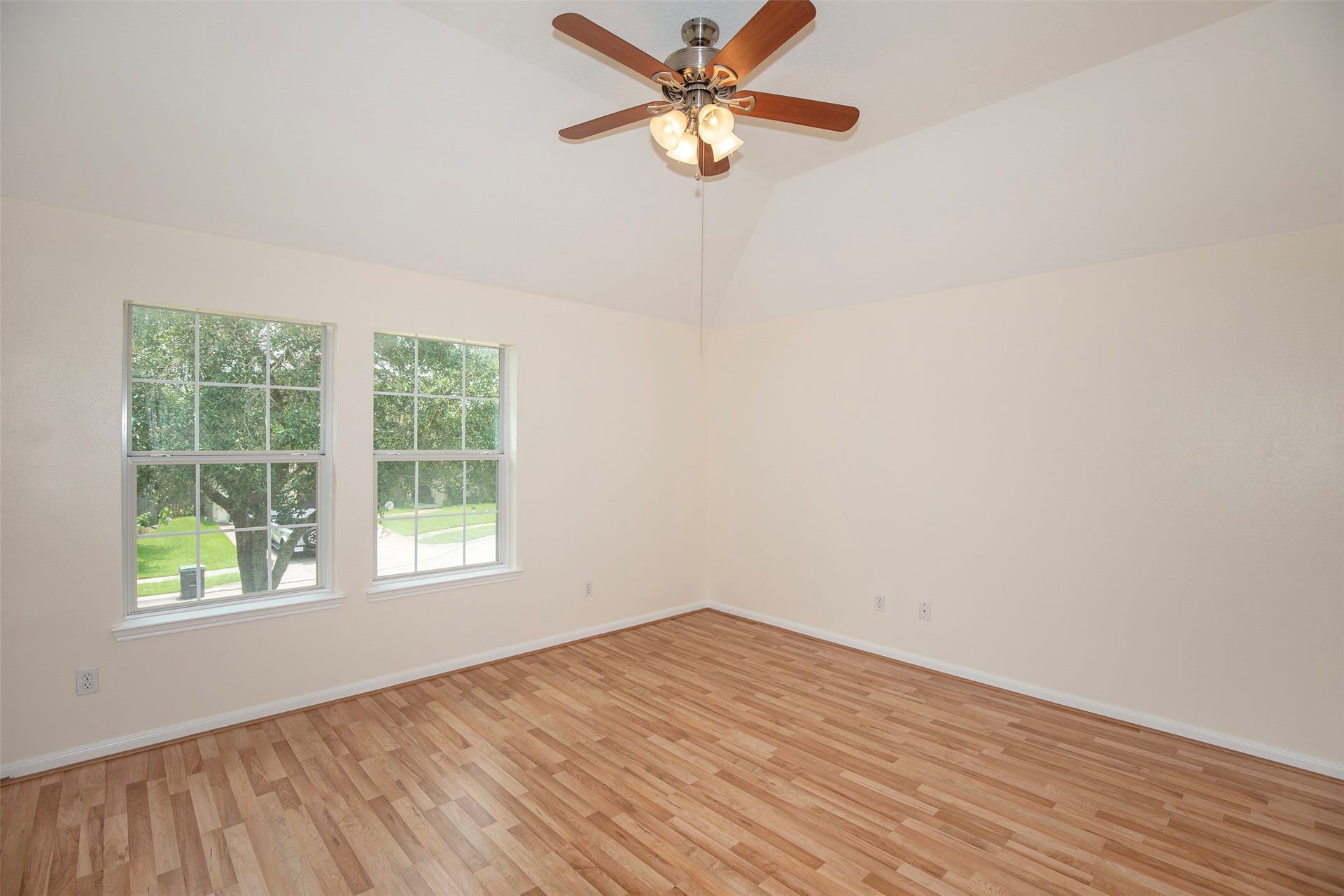3612 Fir Hollow Way, Pearland, TX 77581 Spacious upstairs bedroom suite #1 features beautiful natural light, durable flooring, and the added convenience of a private ensuite bath.