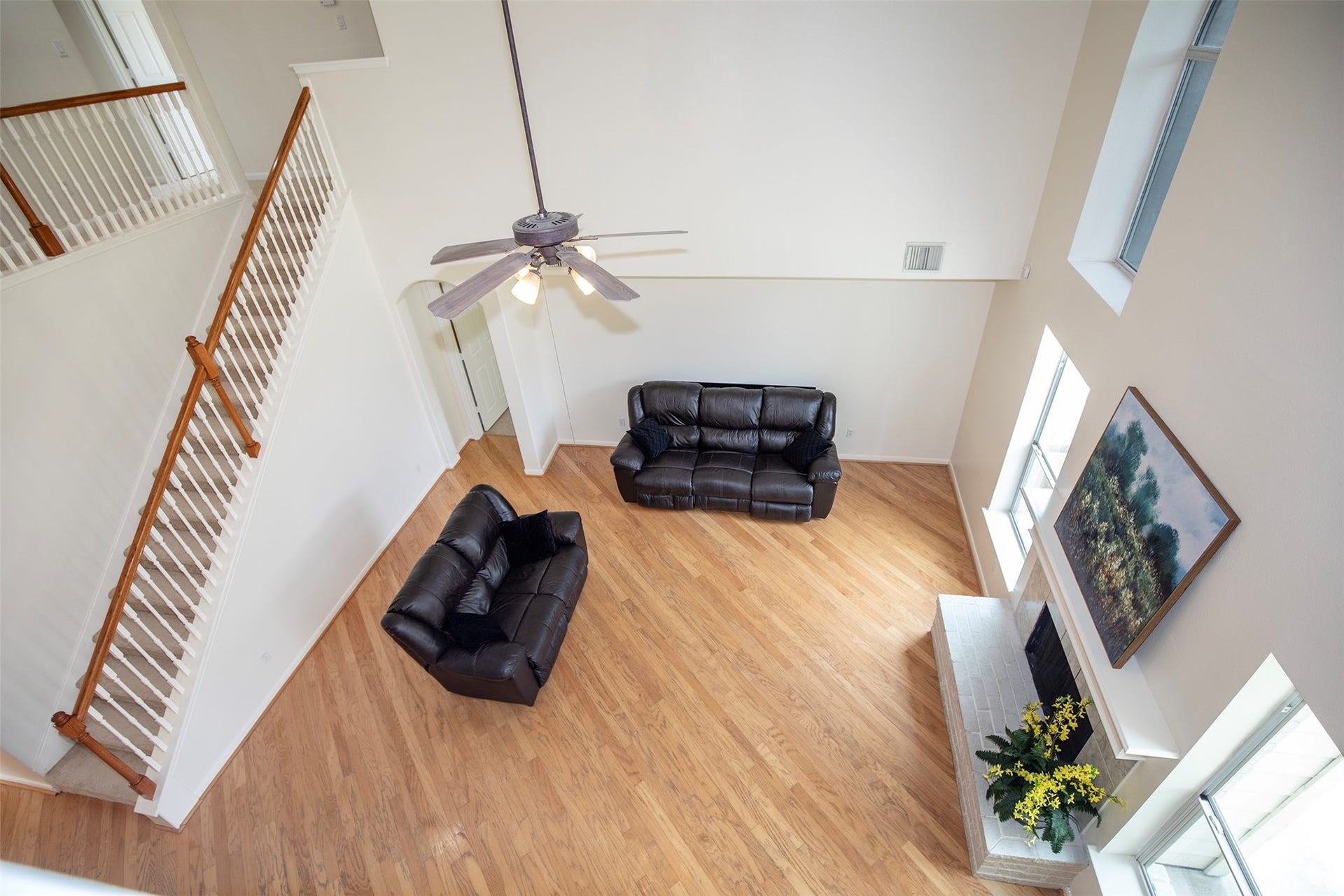 3612 Fir Hollow Way, Pearland, TX 77581 An impressive bird's-eye view highlights the scale of the family room and the elegant open staircase overlooking the heart of the home.