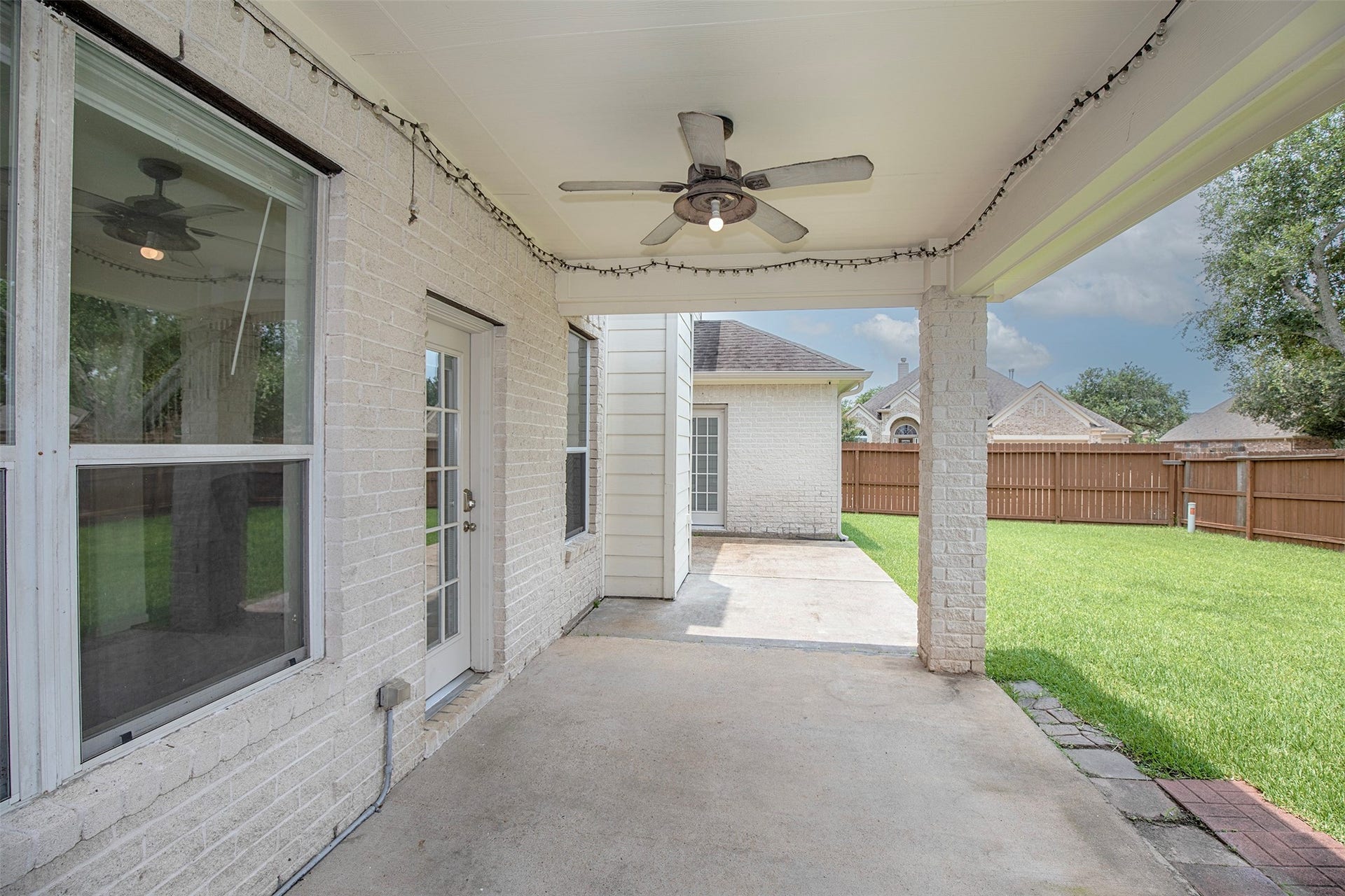 3612 Fir Hollow Way, Pearland, TX 77581 Expansive covered patio and private backyard create the perfect setting for outdoor living.