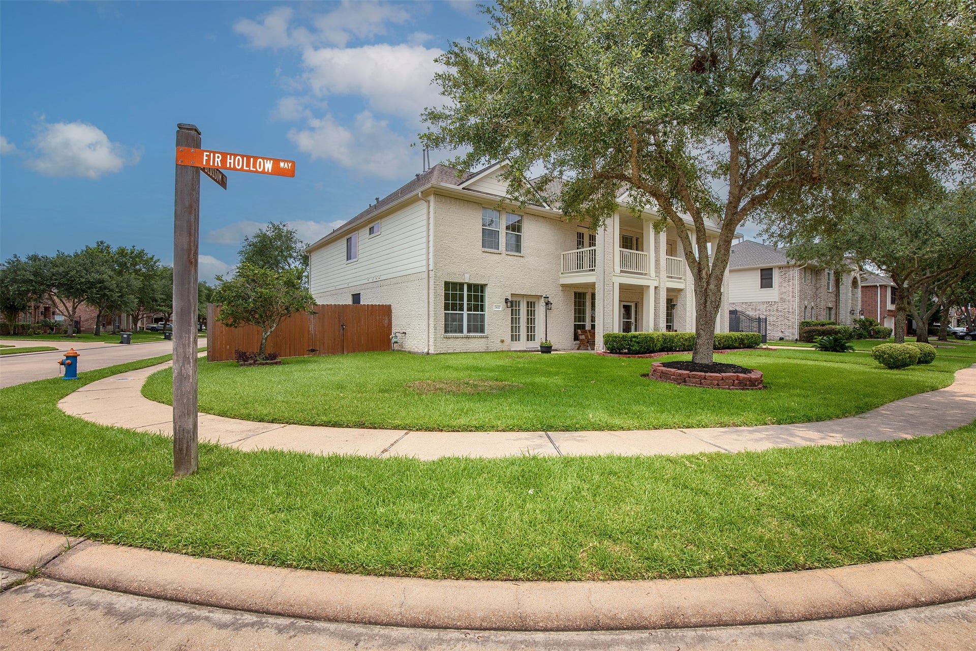 3612 Fir Hollow Way, Pearland, TX 77581 Corner lot location with gated driveway, mature landscaping, and exceptional curb appeal.