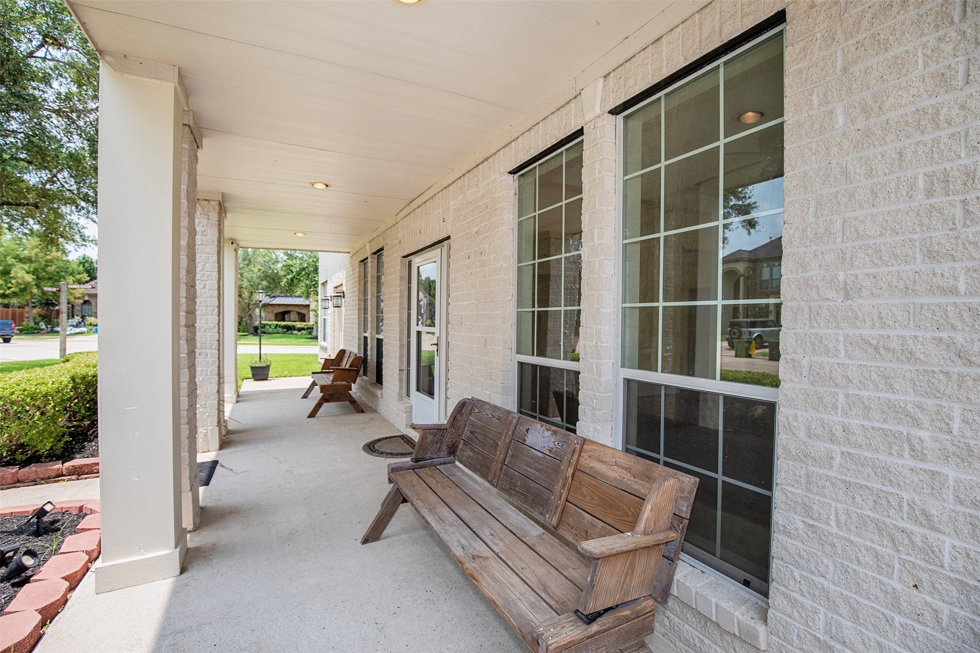 3612 Fir Hollow Way, Pearland, TX 77581 Classic porch seating areas and charming architectural details add warmth and character to the home's inviting exterior.