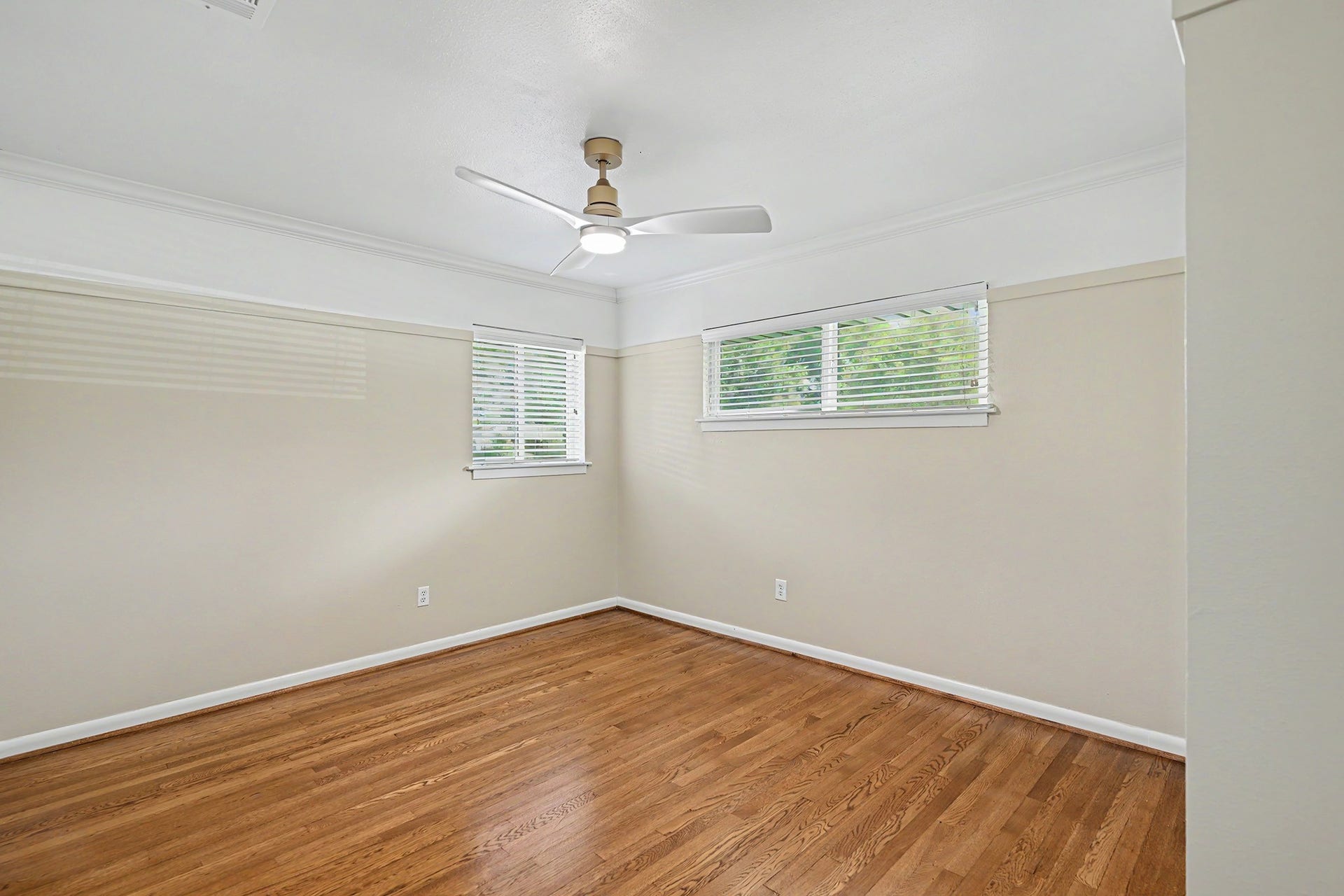 Secondary bedroom with hardwood floor