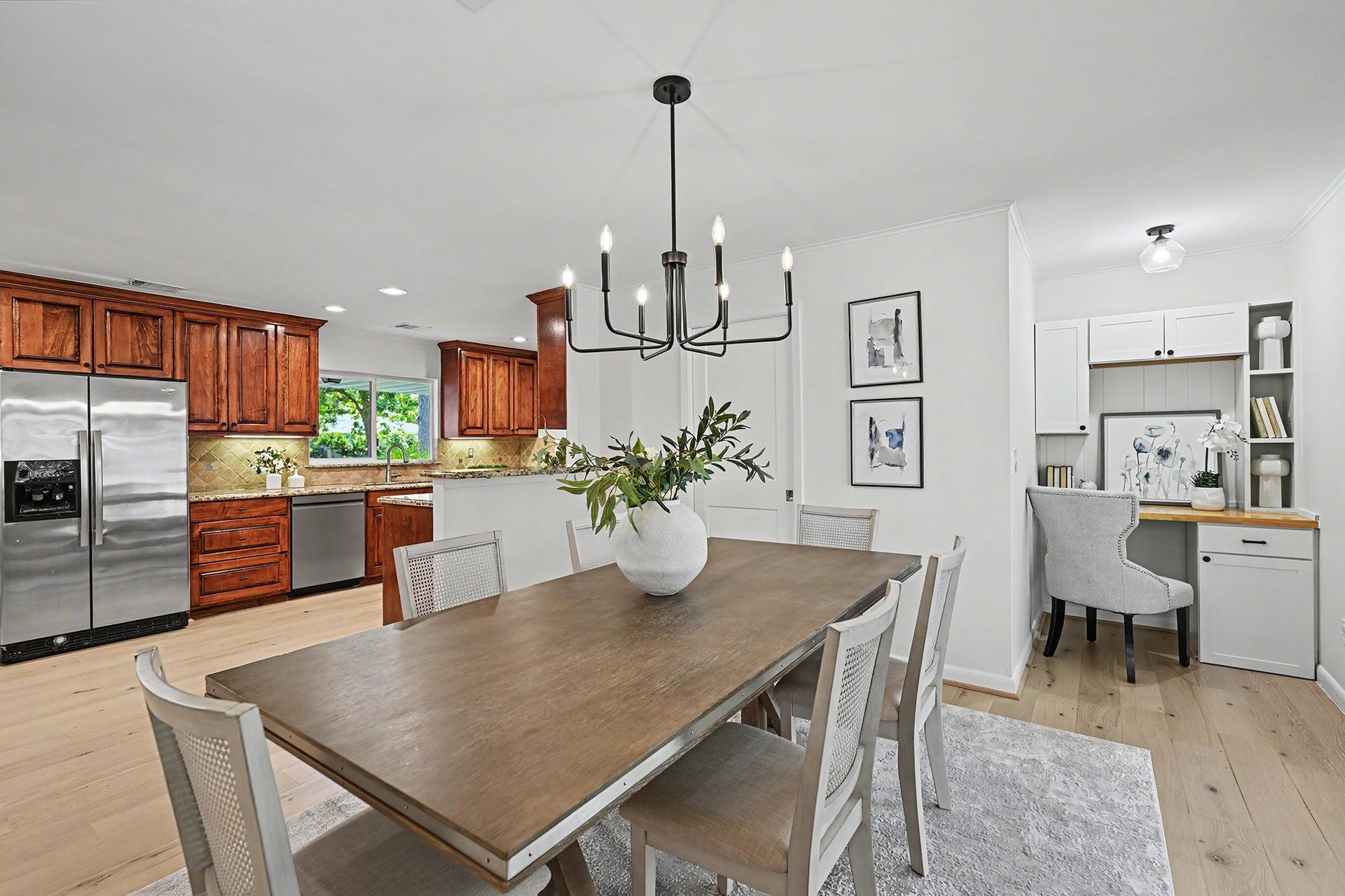 Extra space for large gatherings in the dining room; office nook just behind and utility room in-house behind the closed door