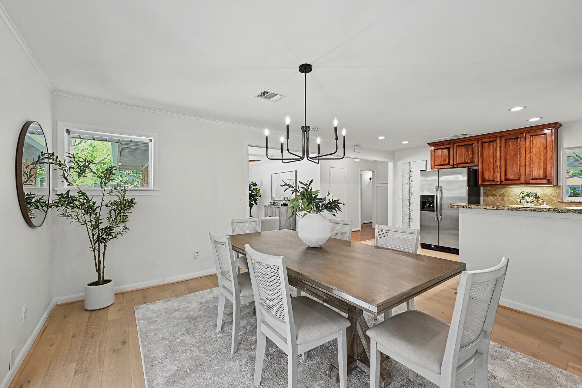 Sunny dining area with engineered wood floors