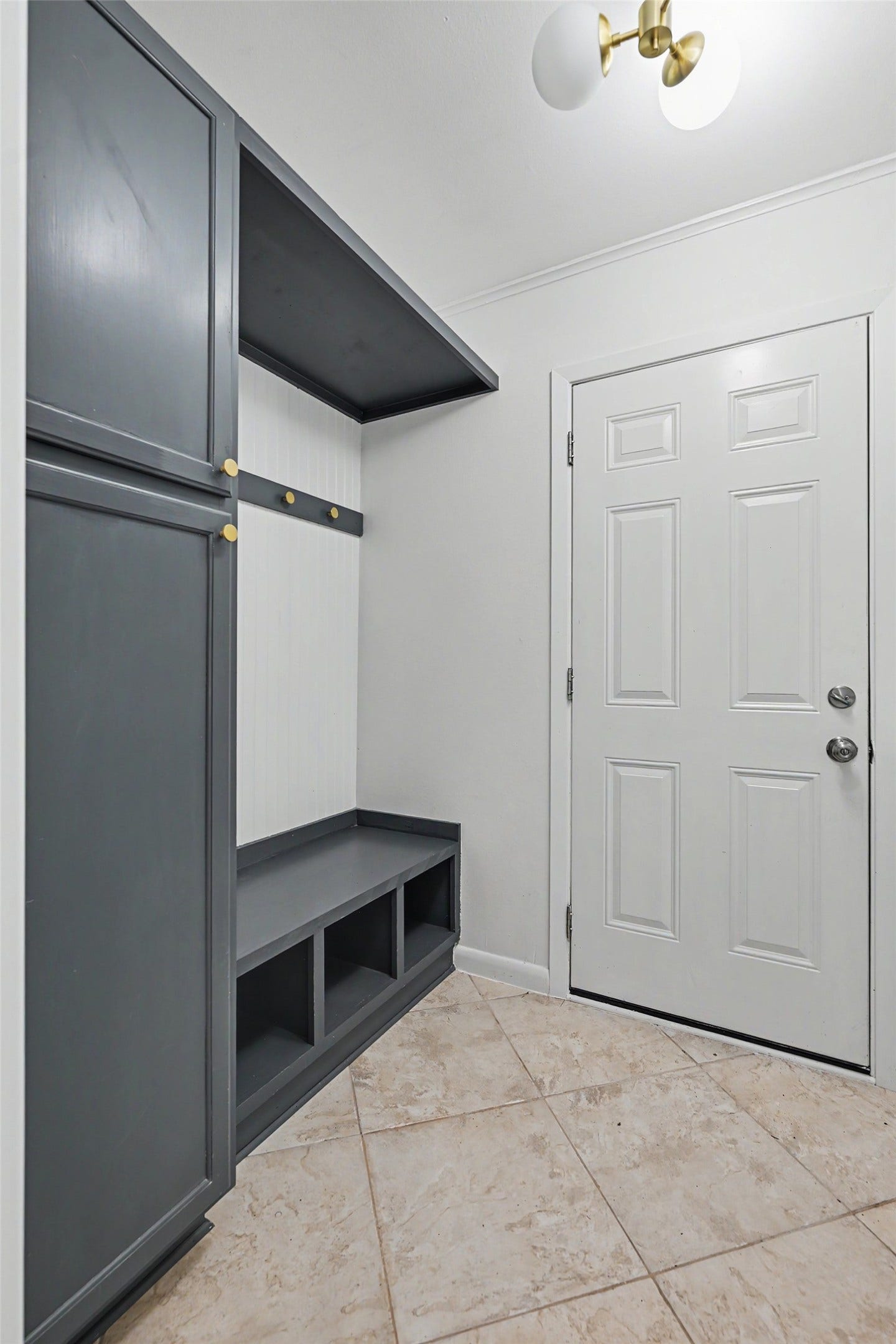 In-house utility room/mudroom (washer and dryer places are to the right, just out of frame). Door leads to the 2 car garage which has a recent epoxy floor and a mini-split heat pump so you can work comfortably!