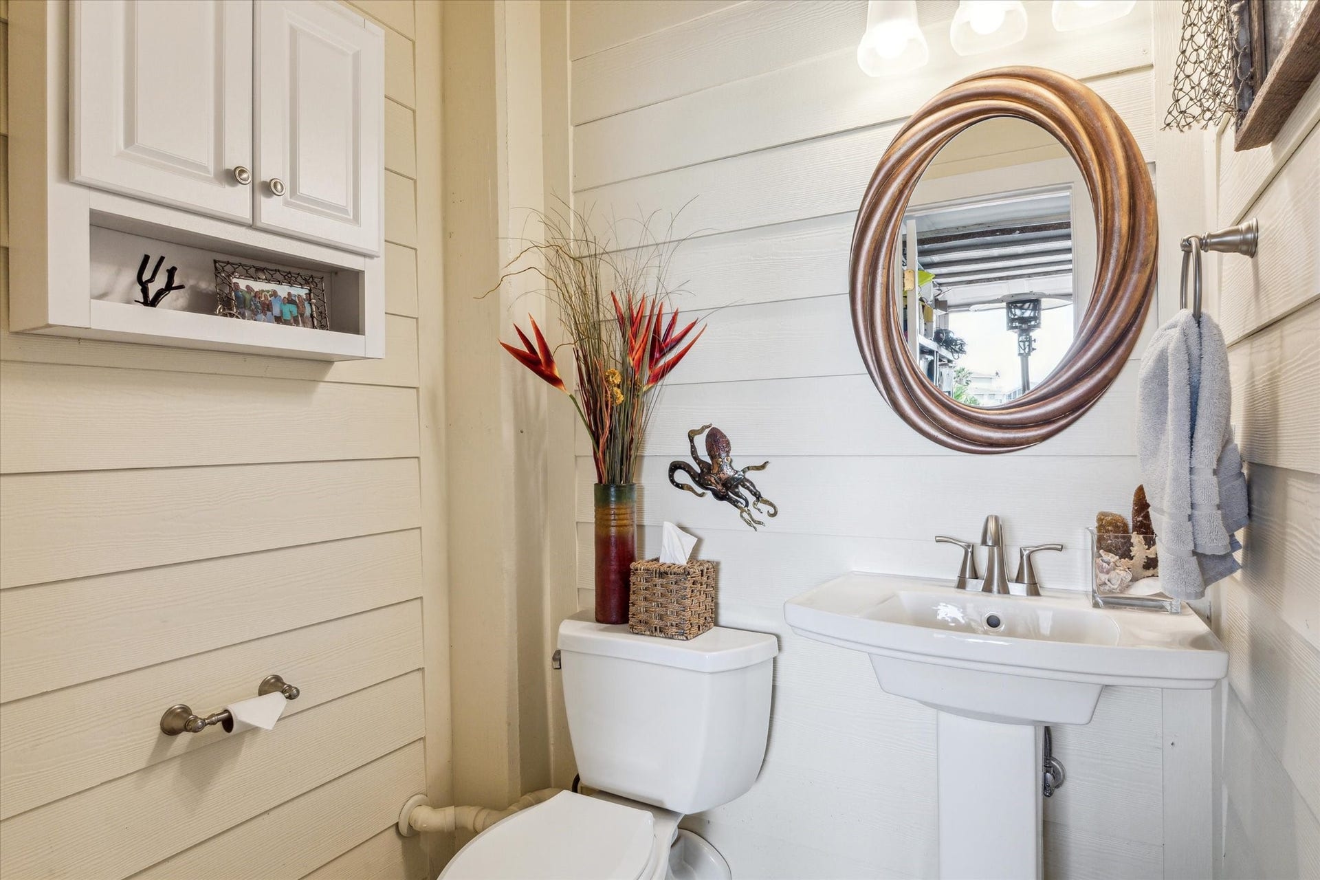 102 Bamaku Bend, Tiki Island, TX 77554 This half bathroom was added inside one of the 4 garage stalls so that you won't have to go upstairs while enjoying the pool or outdoors.