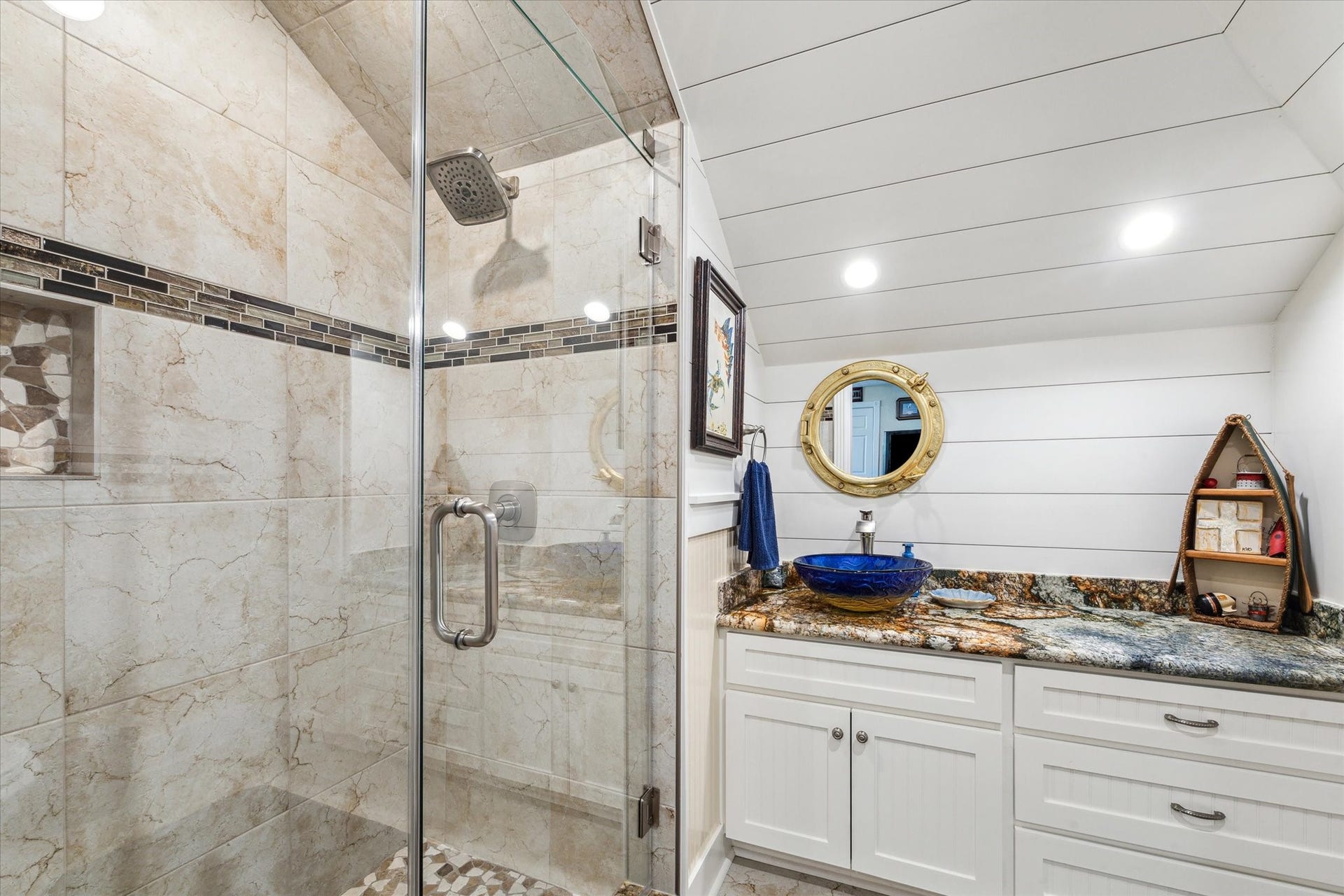 102 Bamaku Bend, Tiki Island, TX 77554 The coastal feel and details continue in the upstairs bathroom with the shiplap, custom walk-in shower, upgraded granite vanity with beautiful vessel sink.