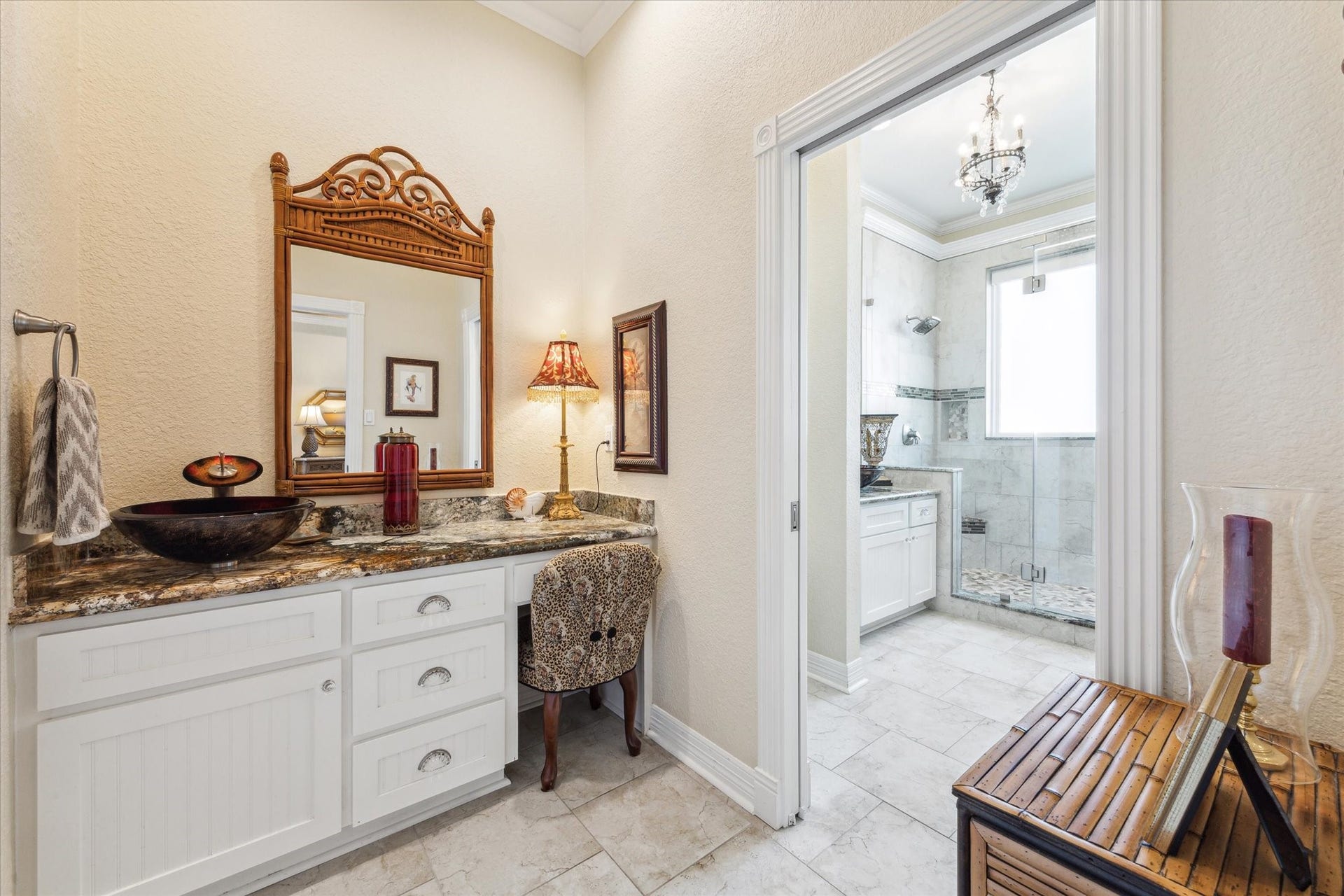 102 Bamaku Bend, Tiki Island, TX 77554 The Primary Bathroom is divided into two rooms. This one has a makeup vanity and vessel sink plus a walk-in closet.