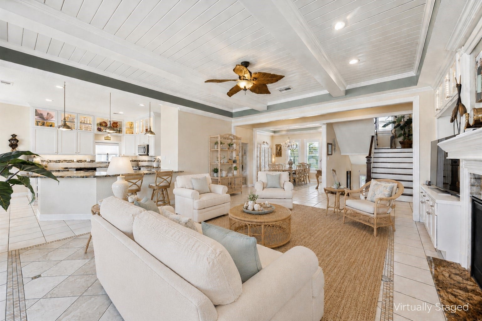 102 Bamaku Bend, Tiki Island, TX 77554 This virtually staged photo shows the view from the back of the home and the wonderful flow between the kitchen and breakfast room, formal dining room and living room.