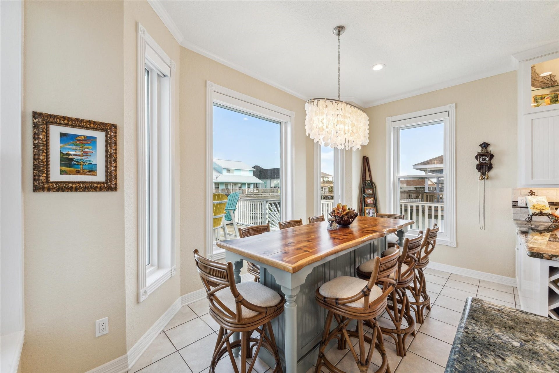 102 Bamaku Bend, Tiki Island, TX 77554 The breakfast room is centered around the custom built cedar wood top table which offers additional storage below. This table stays with the home!
