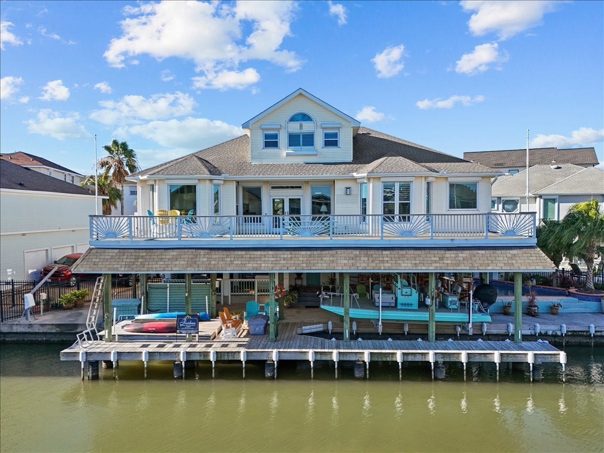 102 Bamaku Bend, Tiki Island, TX 77554 This canal front home in the community of Tiki Island offers everything you've been looking for! 3-4 bedrooms or office, upstairs gameroom, heated pool, two boat lifts, 150 gallon live bait well, stainless fish cleaning table with sink, 4 garages with one converted to a storage/workshop with half bath plus an updated elegant interior design. There are too many upgrades to mention.