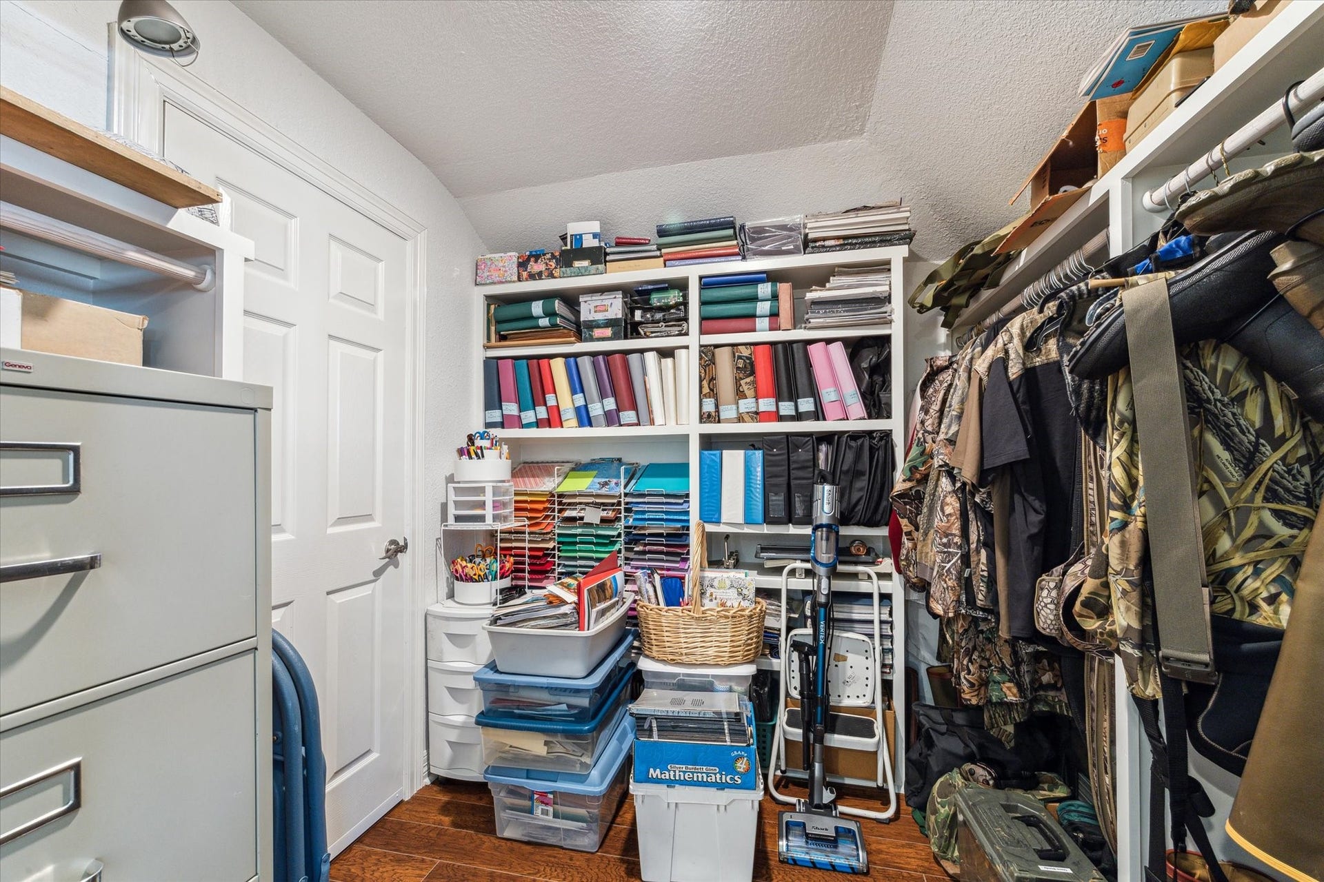 102 Bamaku Bend, Tiki Island, TX 77554 This is the oversized 10x10 walk-in closet upstairs perfect for extra storage, crafting supplies or whatever your needs may be. There is also access to the attic in this room.