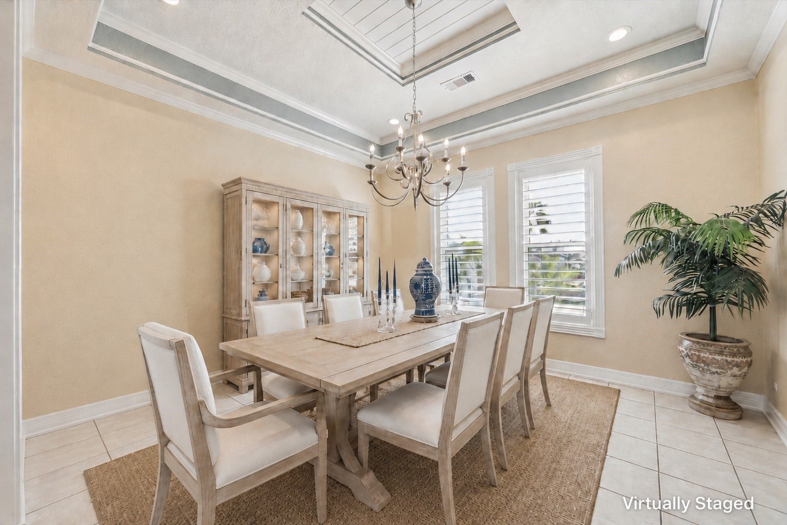 102 Bamaku Bend, Tiki Island, TX 77554 This virtually staged formal dining room features a continuation of the beadboard ceiling, extensive crown molding and trim detail as well as designer paint colors chosen from historic Galveston homes.