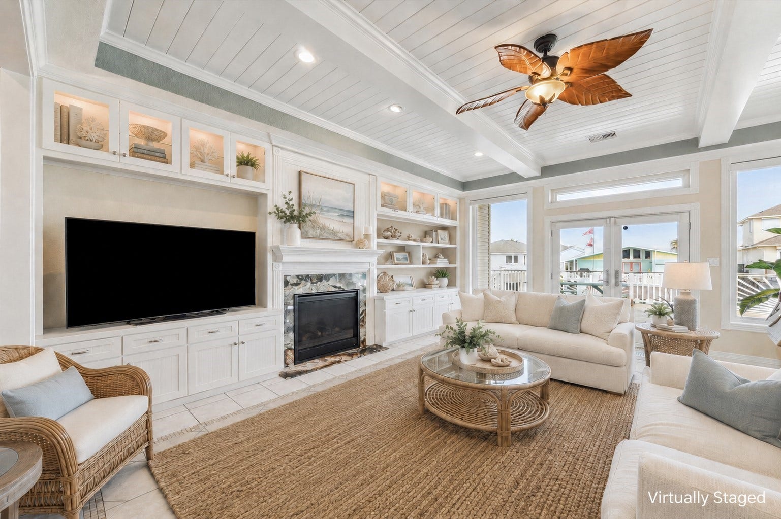 102 Bamaku Bend, Tiki Island, TX 77554 Welcome inside the beautiful 102 Bamaku Bend. This virtually staged photo of the living room highlights all of the beautiful details in this home.