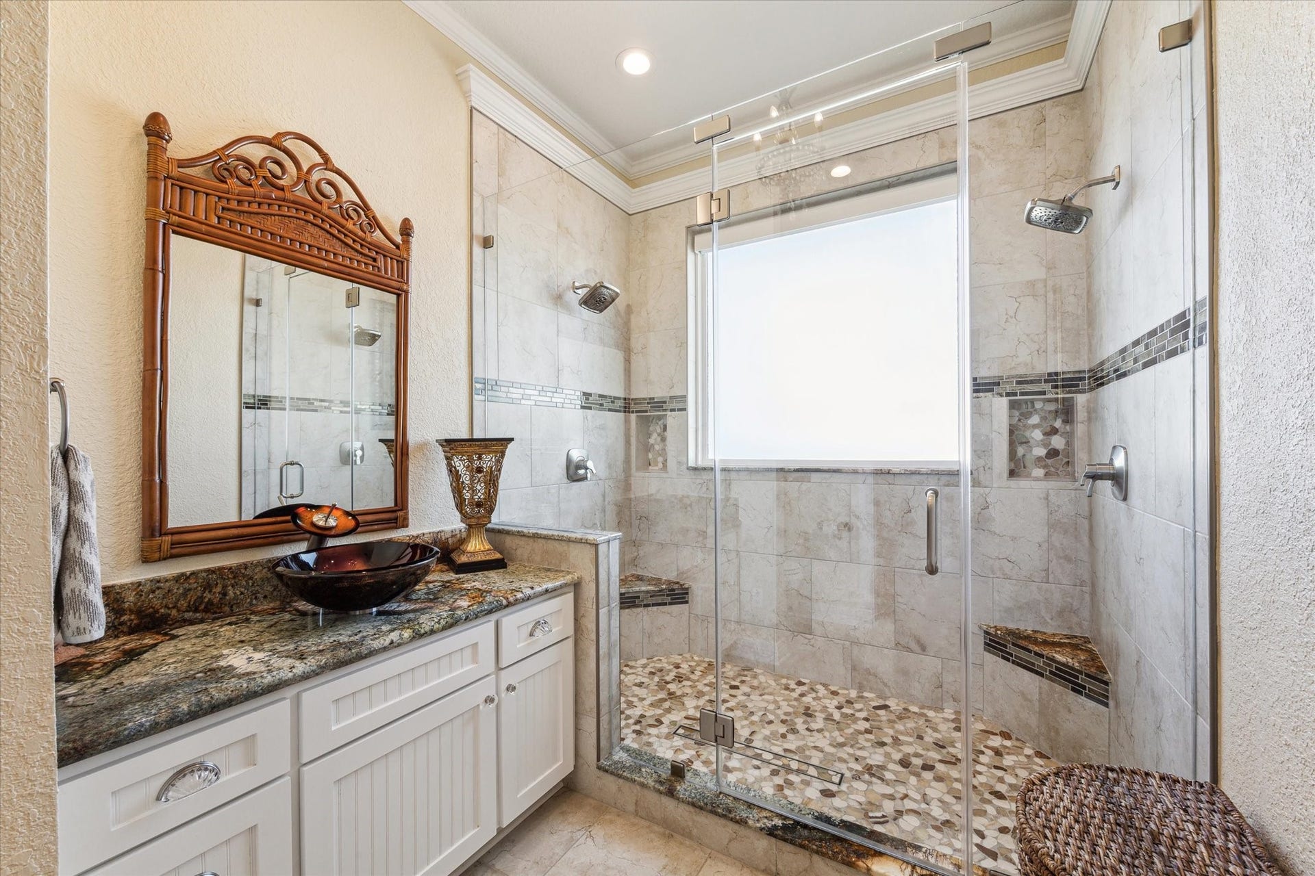 102 Bamaku Bend, Tiki Island, TX 77554 The second area of the Primary Bathroom offers a large walk-in shower with two benches, 2 rain shower heads, a second vanity with vessel sink and the toilet.