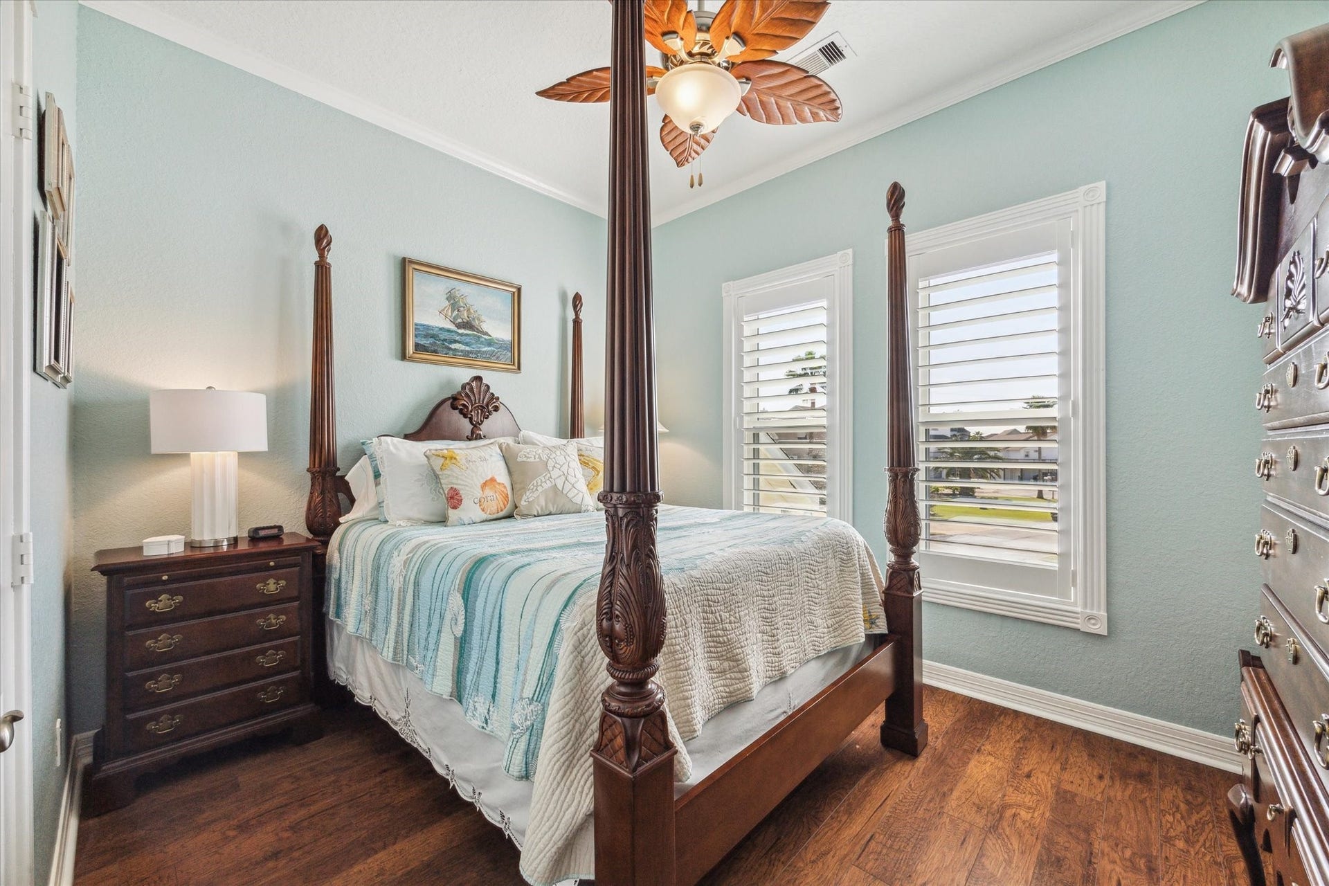 102 Bamaku Bend, Tiki Island, TX 77554 This bedroom provides a soothing paint color, wood floors and plantation shutters.