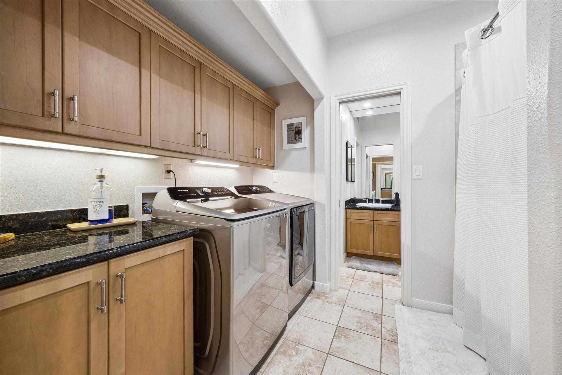 Fabulous laundry area with great storage and under cabinet lighting