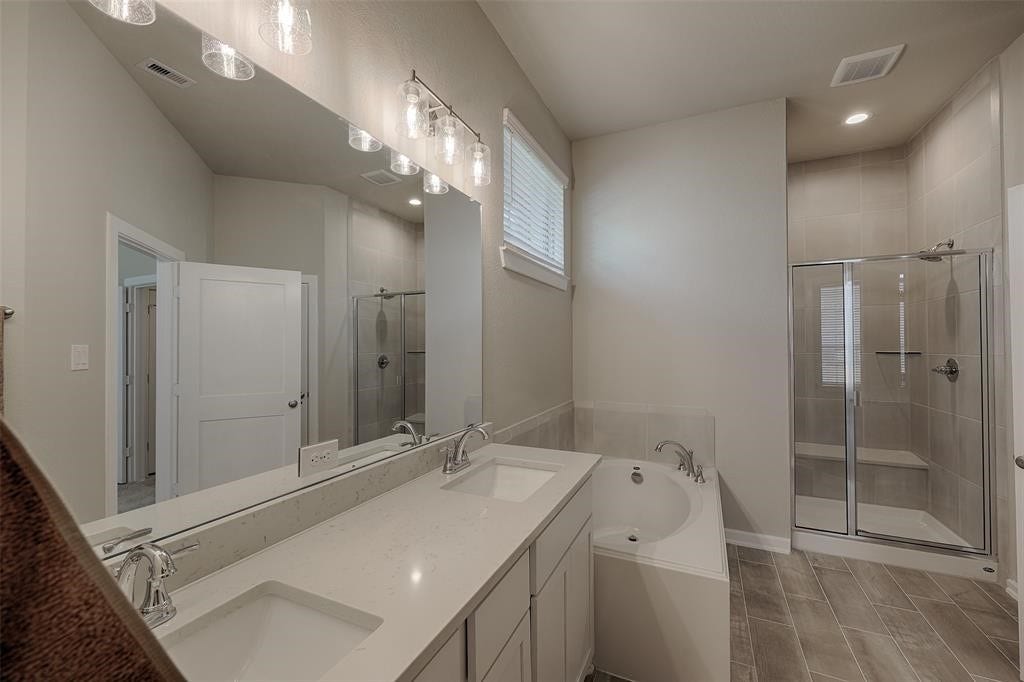 115 Handley Drive, Montgomery, TX 77316 Primary bath has double sinks, soaking tub plus large walk in shower with seat.
