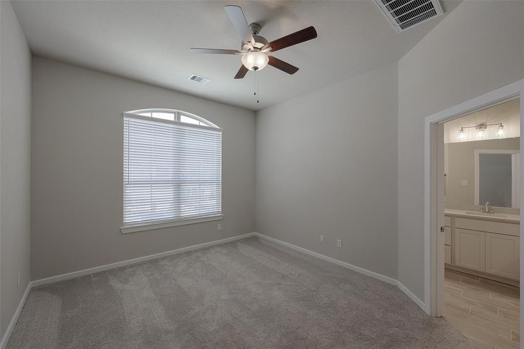 115 Handley Drive, Montgomery, TX 77316 Large secluded primary bedroom on main living area.