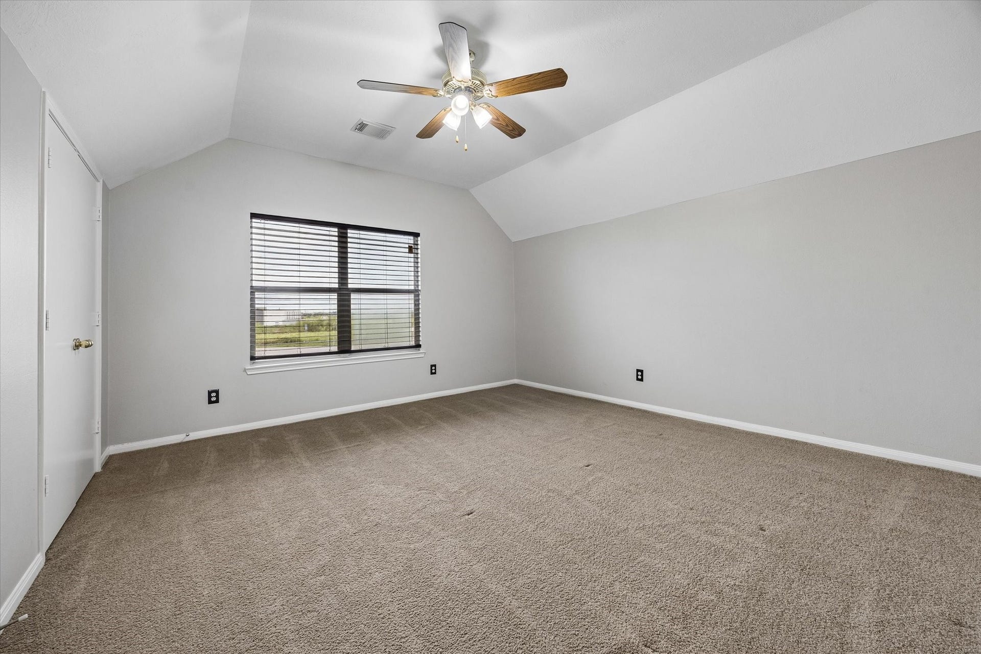 8422 W W Sienna Cove Lane Lane, Houston, TX 77083 Spacious Secondary Bedroom: Generously sized room off the game room, offering flexibility as a media room, bonus room, or additional bedroom.
