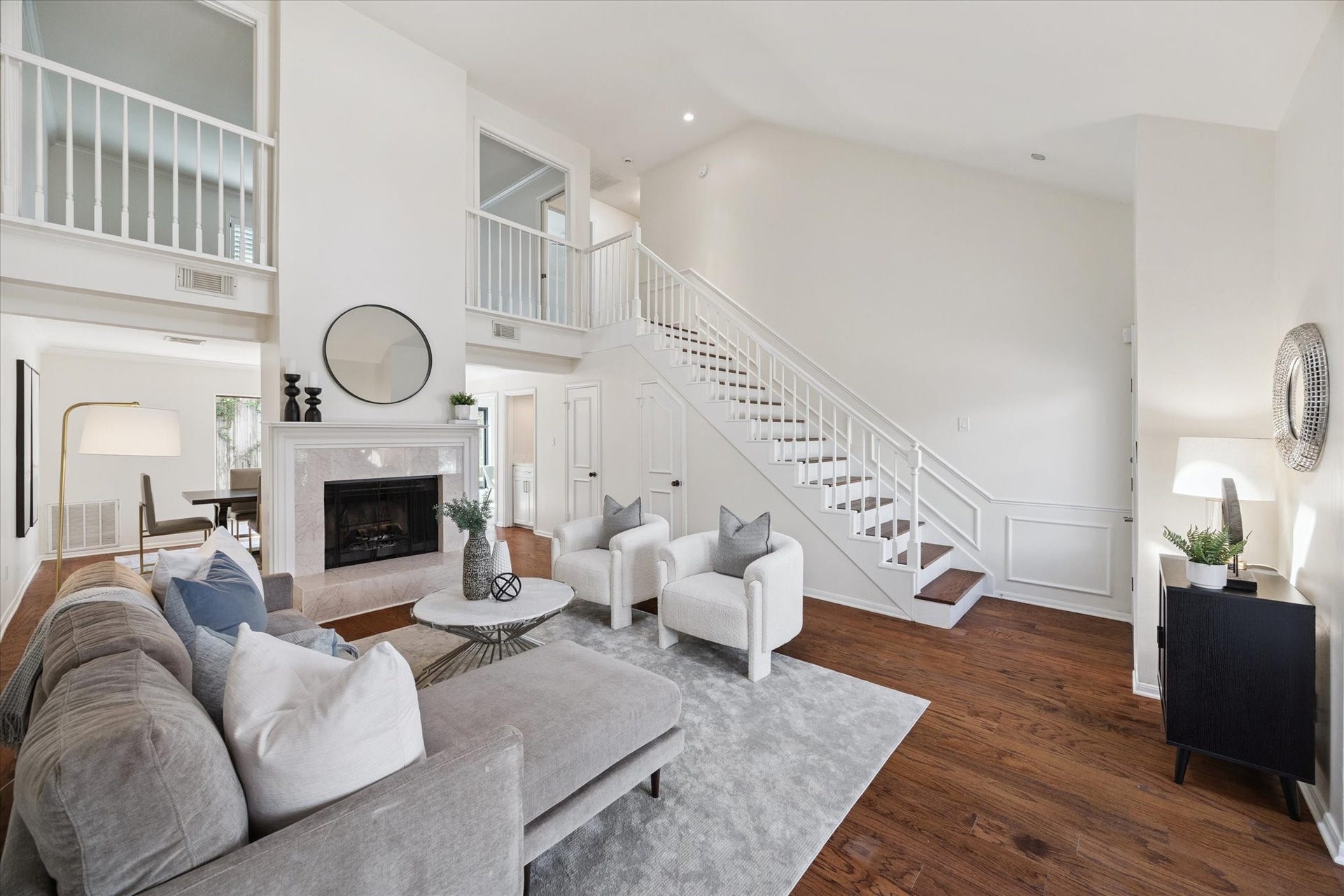 2422 Nantucket Drive, #C, Houston, TX 77057 Living room: 19X15. Rich
hardwoods, wood burning fireplace
with attractive mantle & marble
surround.