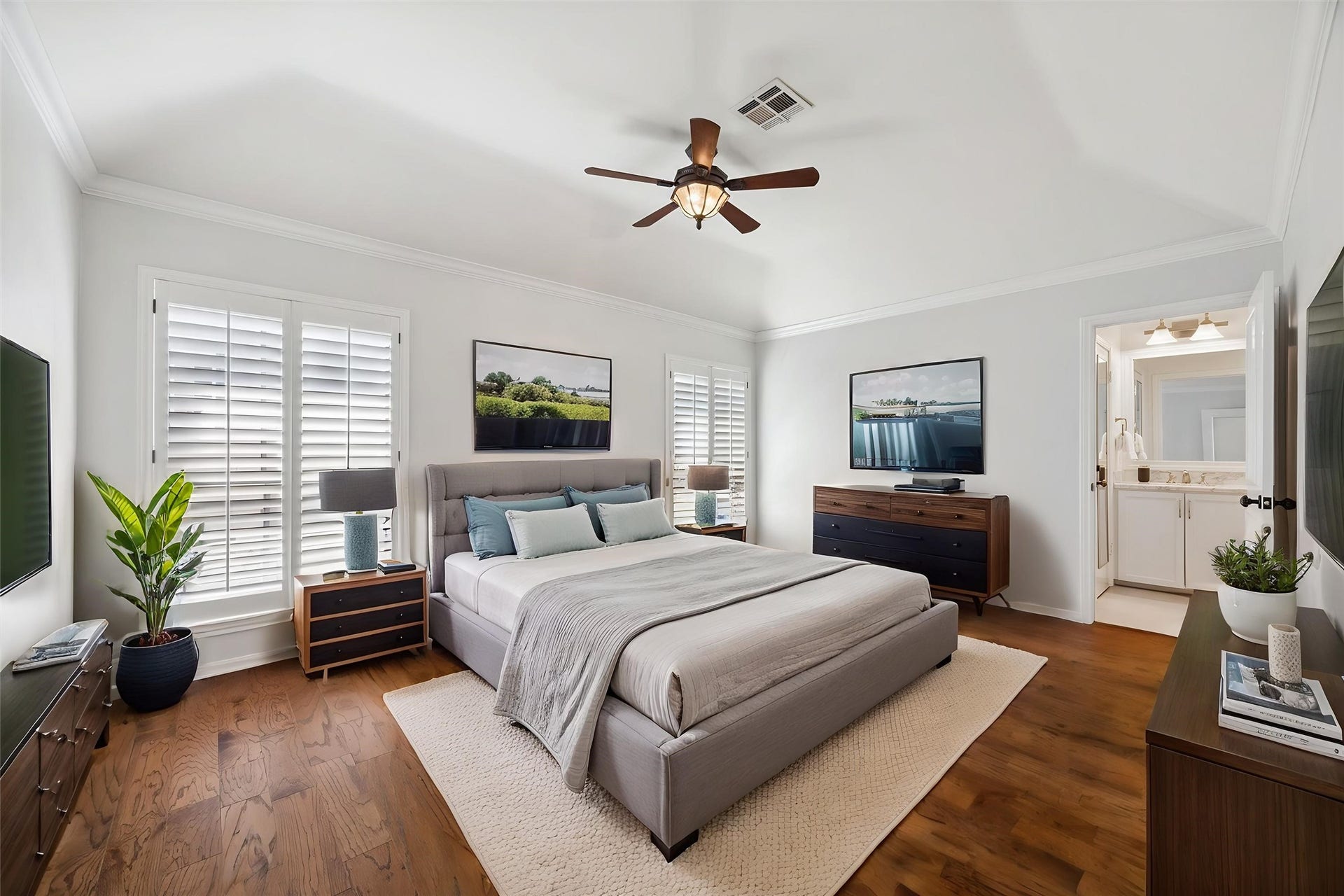2422 Nantucket Drive, #C, Houston, TX 77057 Primary bedroom: 16 x 13. Plantation
shutters, hardwoods, freshly painted,
filled with natural light! You can see the entrance to the en suite bathroom in the background. This room is virtually staged.