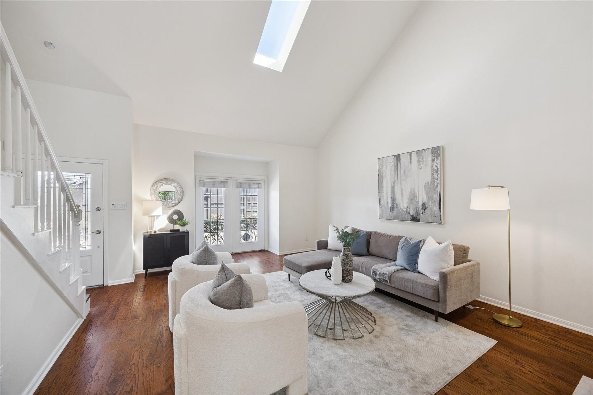 2422 Nantucket Drive, #C, Houston, TX 77057 The living room is immediate upon entering the home it has a dry bar and a fireplace out of frame.