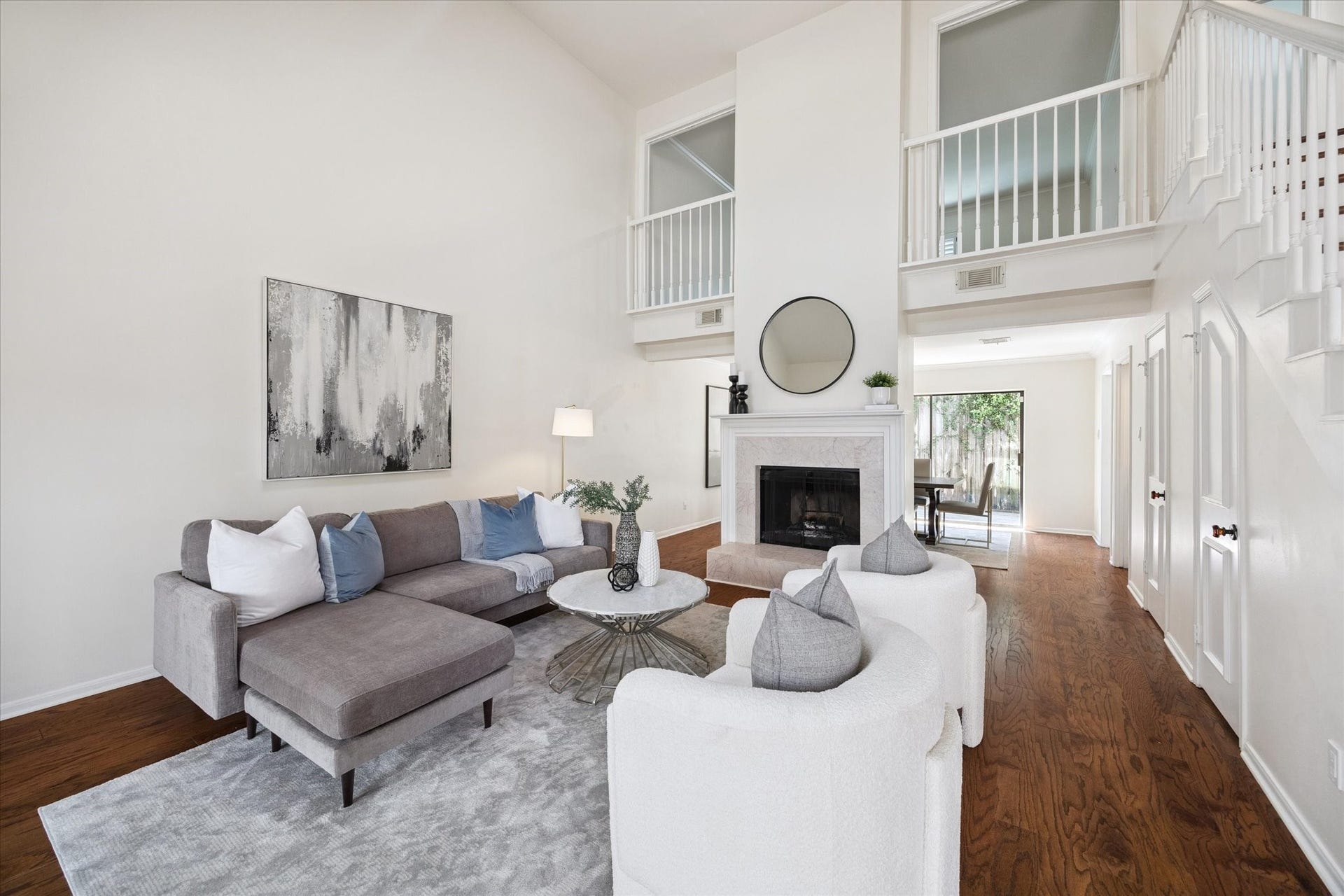 2422 Nantucket Drive, #C, Houston, TX 77057 The living room opens up beautifully with its two story ceiling, you can see the balcony of the upstairs bedroom in the top of the photograph.
