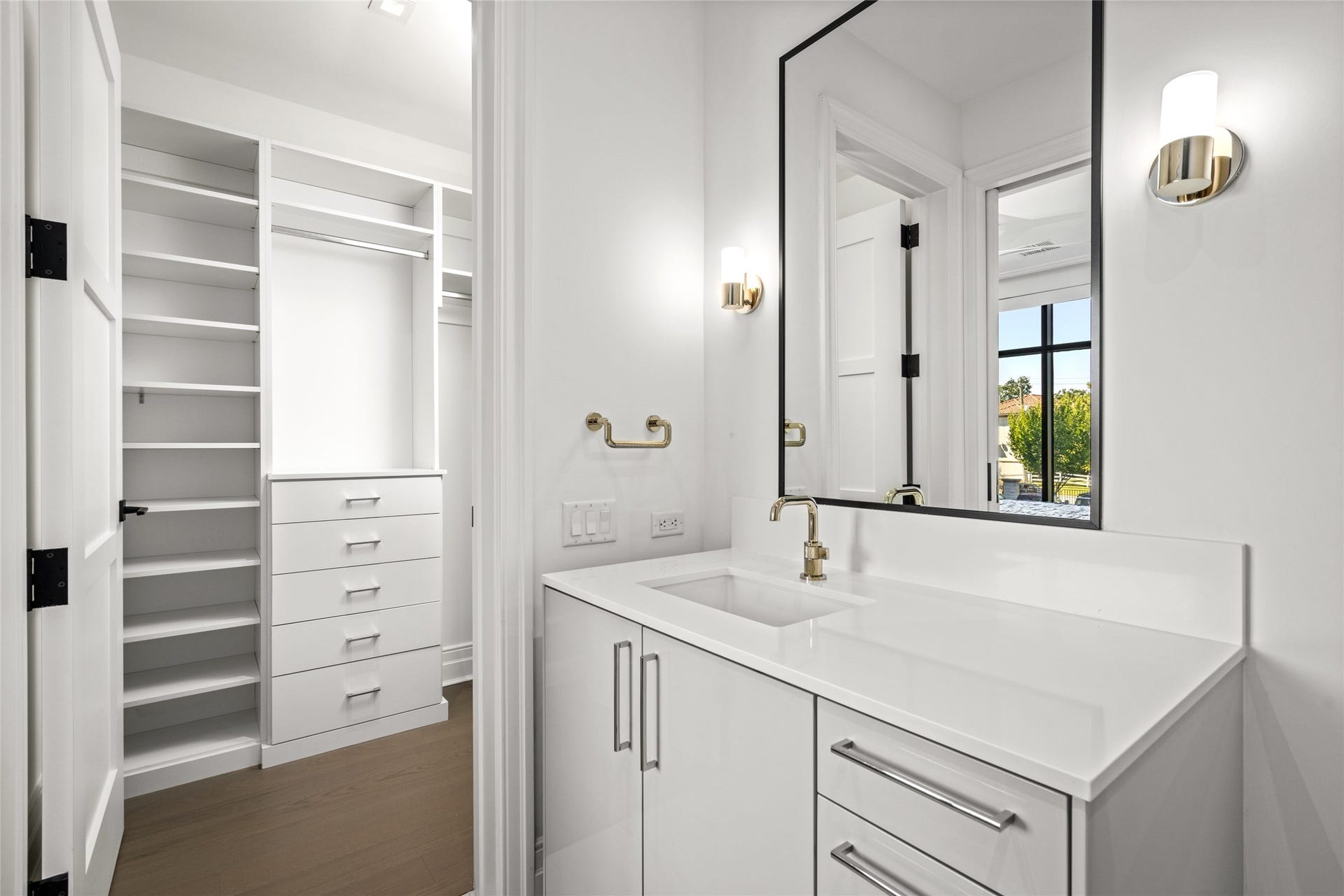 6017 Memorial, #202, Houston, TX 77007 Exquisite, lasting finishes throughout, this bathroom features quartz counter, light gray lacquer Siematic cabinetry, accent sconces, and chrome fixtures.