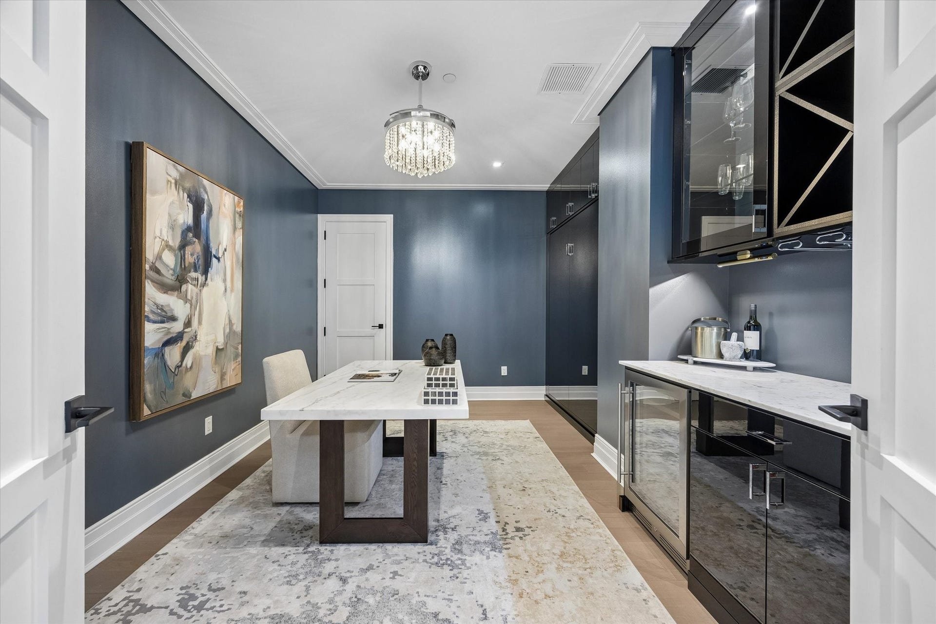 6017 Memorial, #202, Houston, TX 77007 Behind double doors, the flex room offers a private office retreat designed for quiet focus, productivity, or simply escaping, with an elegant fandelier adding both comfort and style.