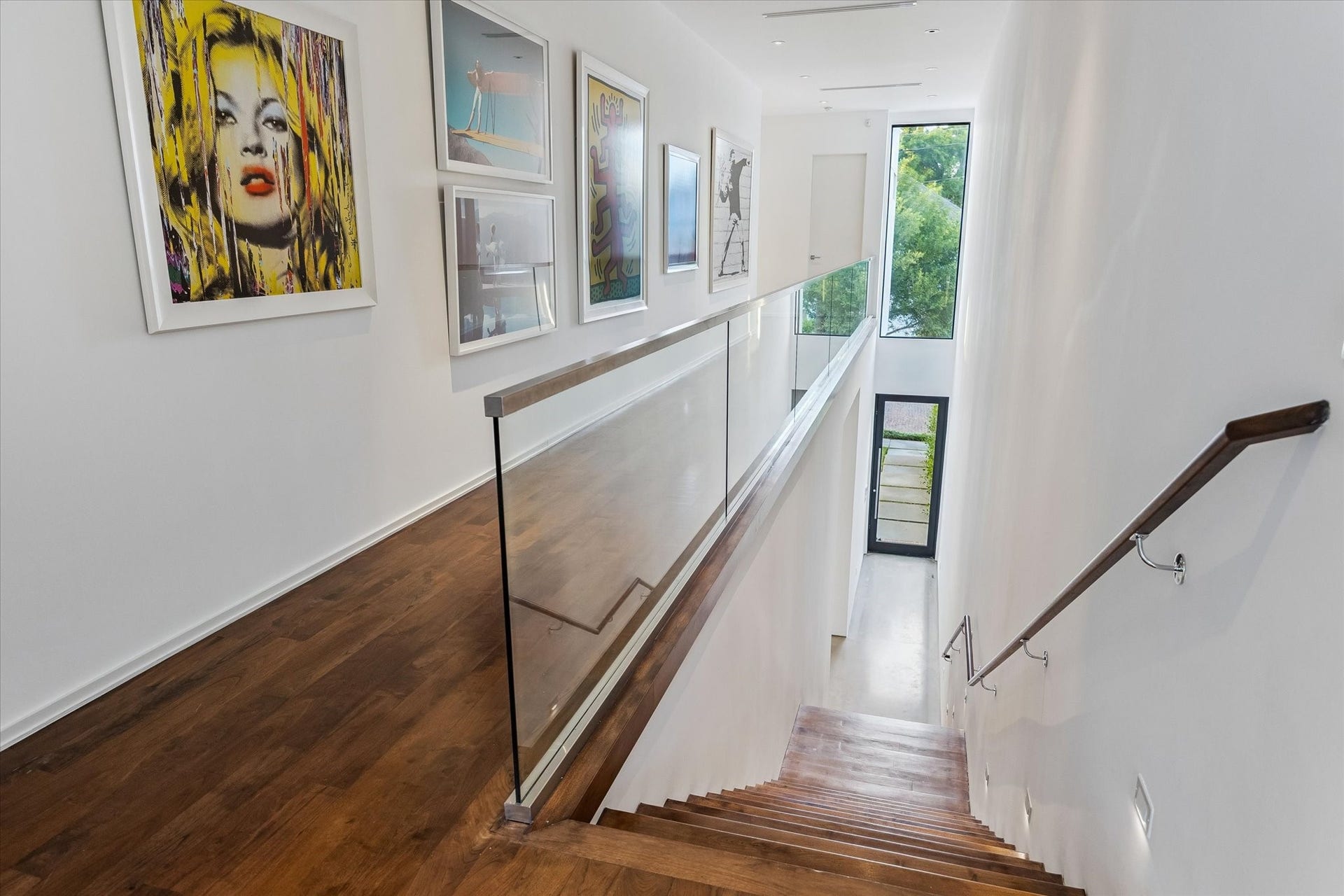1527 Indiana Street, Houston, TX 77006 Floating steel stairs with wood trim. Beautiful European wood floors.