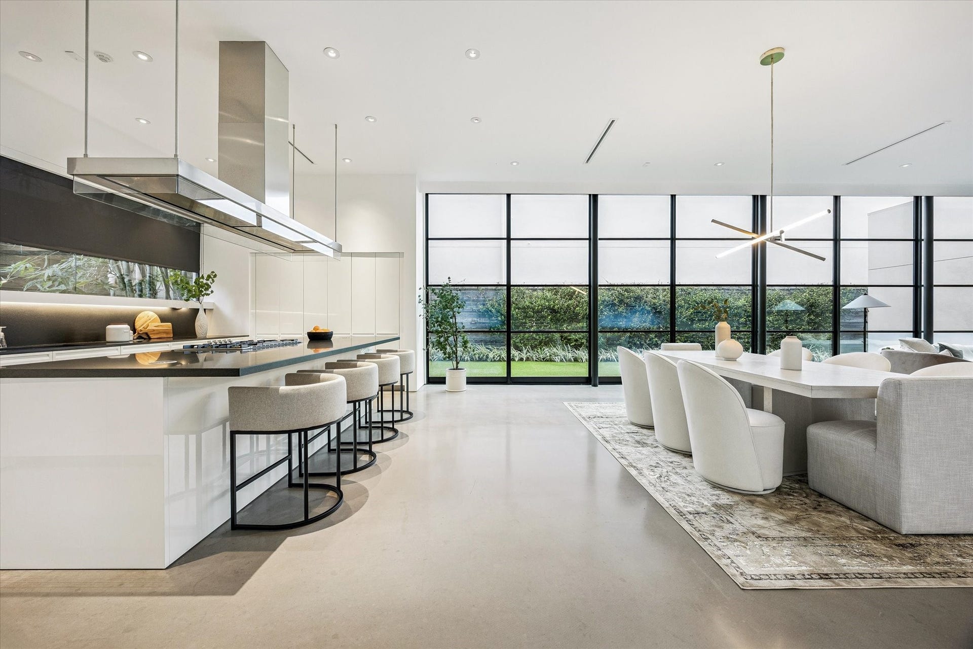 1527 Indiana Street, Houston, TX 77006 Floor-to-ceiling windows with a sliding glass door opening to the backyard.