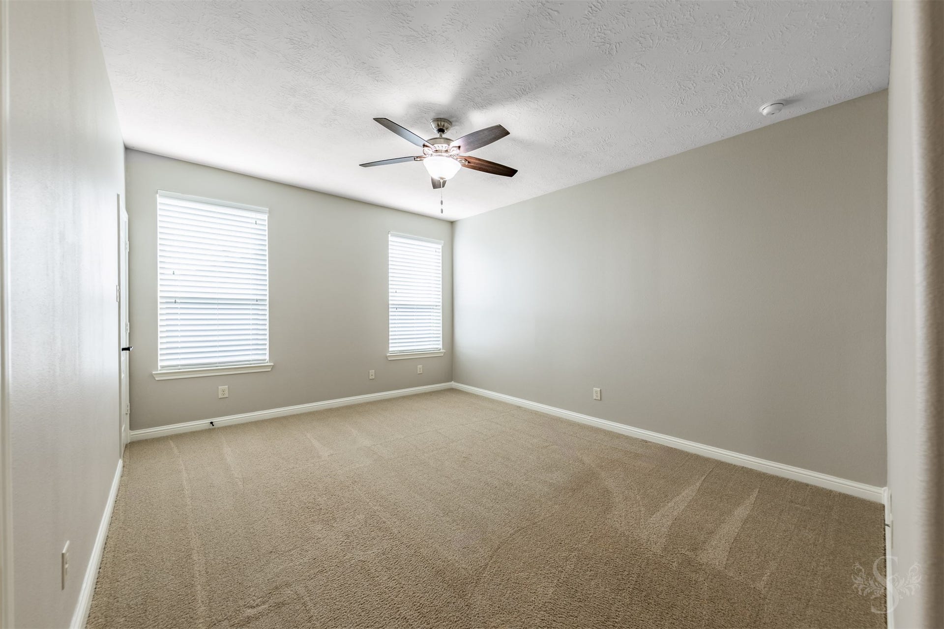 27506 Lakeway Trail Lane, Fulshear, TX 77441 This spacious upstairs bedroom offers abundant room for a full bedroom furniture arrangement. Theres plenty of additional space for a desk, creating a comfortable place to study or pursue creative projects.