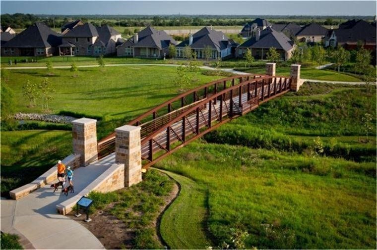 27506 Lakeway Trail Lane, Fulshear, TX 77441 A signature landmark of Cross Creek Ranchthe scenic bridge at Flewellen Creek connects miles of walking trails and expansive green space. Framed by lush landscaping and serene views, its the perfect place for morning jogs, evening strolls, or simply soaking in the natural beauty of the community.