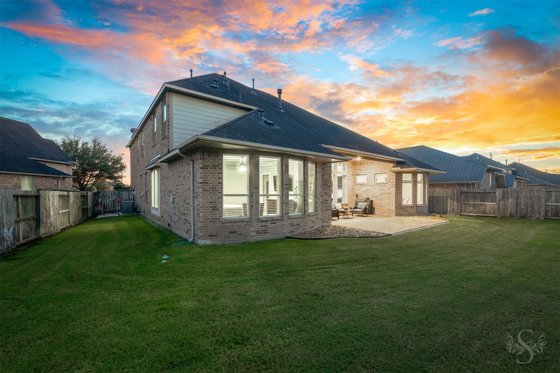 27506 Lakeway Trail Lane, Fulshear, TX 77441 An expansive lawn wraps around the home, providing abundant space for outdoor games, gardening and family fun. The covered patio and adjoining paver extension offer a welcoming setting for relaxed evenings and weekend entertaining.