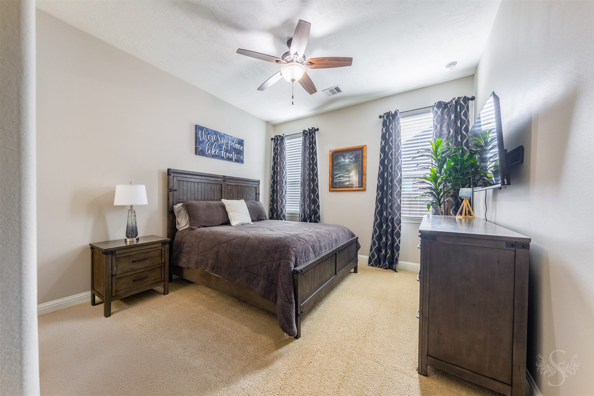 27506 Lakeway Trail Lane, Fulshear, TX 77441 Secondary bedroom featuring soft neutral walls and plush carpeting to create a restful setting. Generous wall space offers flexibility for arranging furnishings and adding personal style.