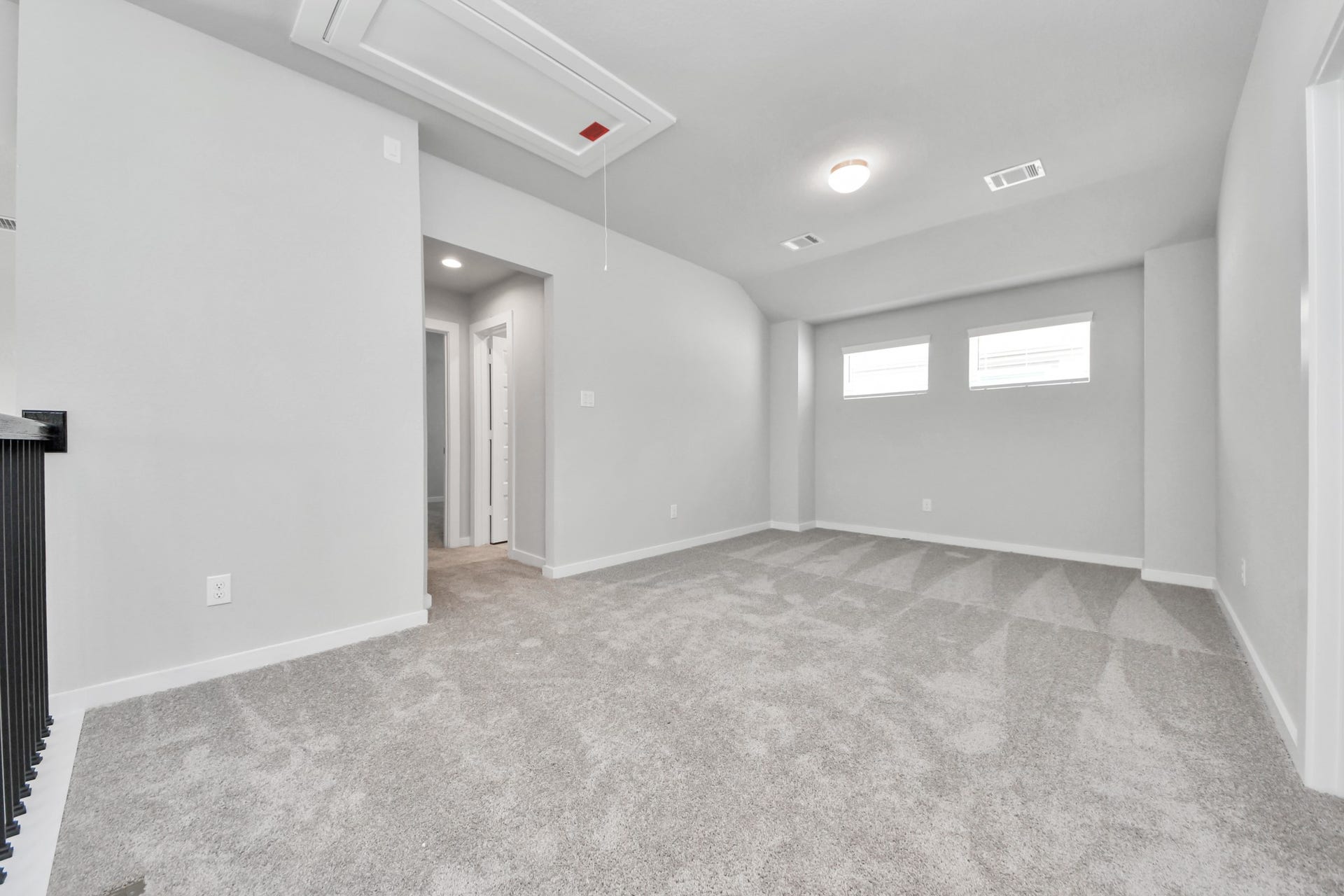 Ascend to relaxation in this fantastic game room! Ideal for both casual gatherings and adult gaming, it boasts plush carpet, lofty ceilings, custom paint, and ample windows for abundant natural light. Sample photo of completed home with similar floor plan. Actual colors and selections may vary.